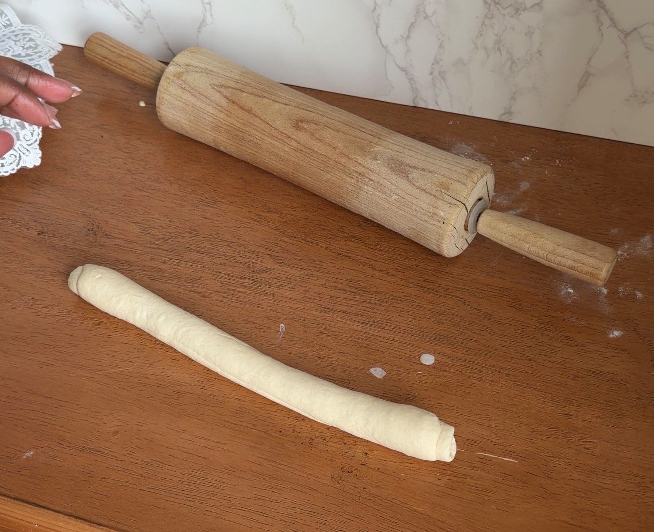 bagel dough on the counter, rolled into rope
