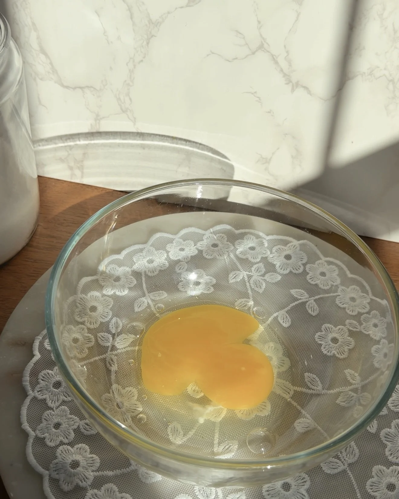 glass mixing bowl with egg
