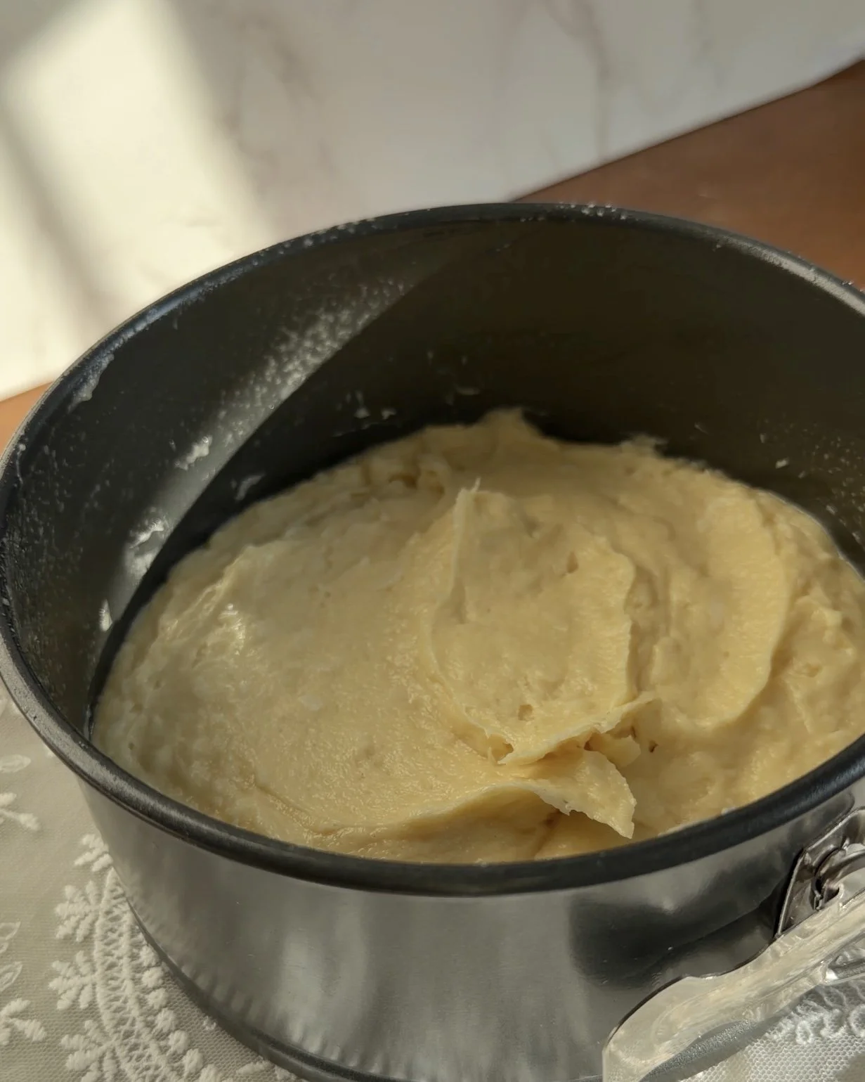 Cake batter in greased 6 inch pan