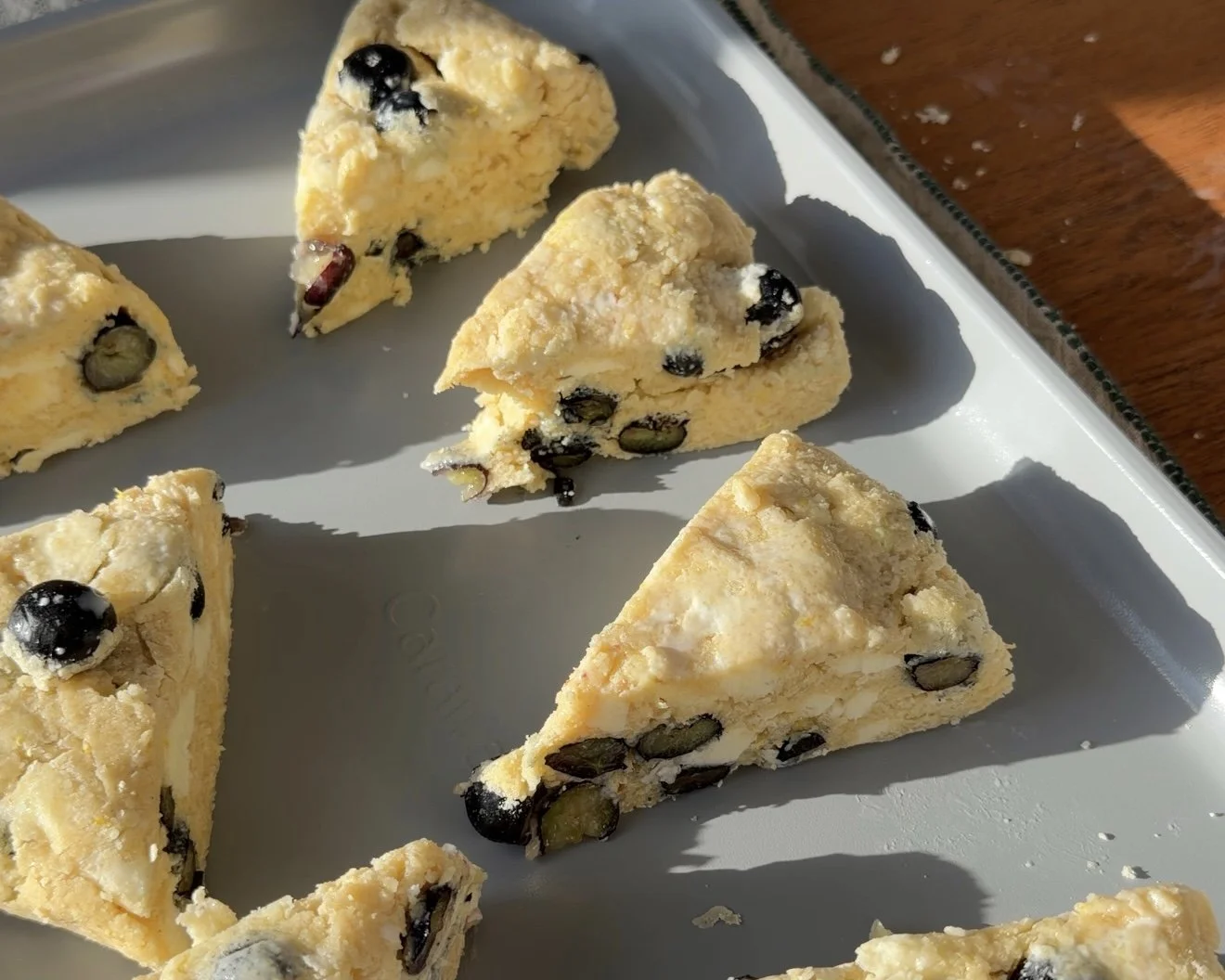 Scones on non stick pan ready to be baked. 