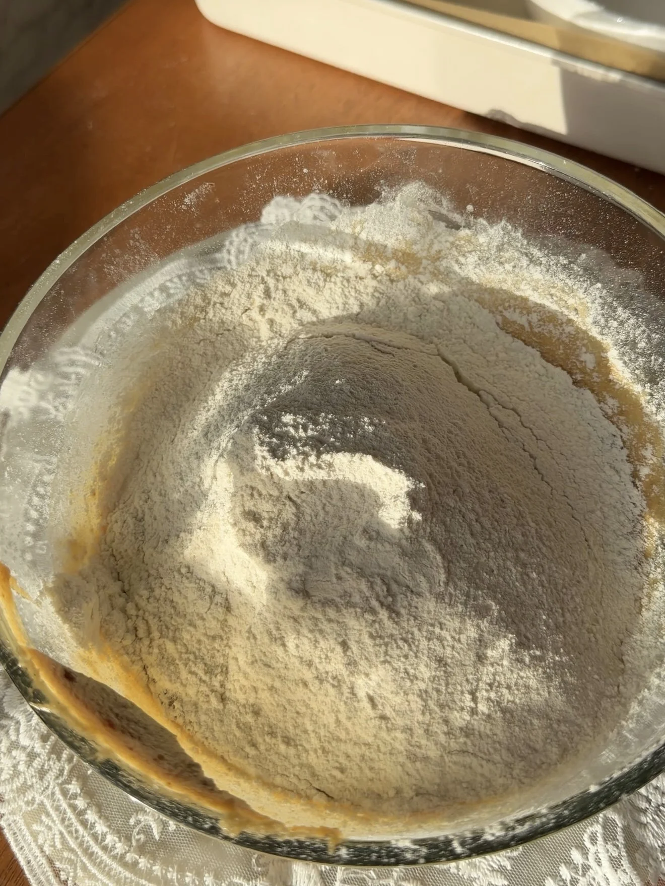 sifted flour and dry ingredients added to wet ingredients