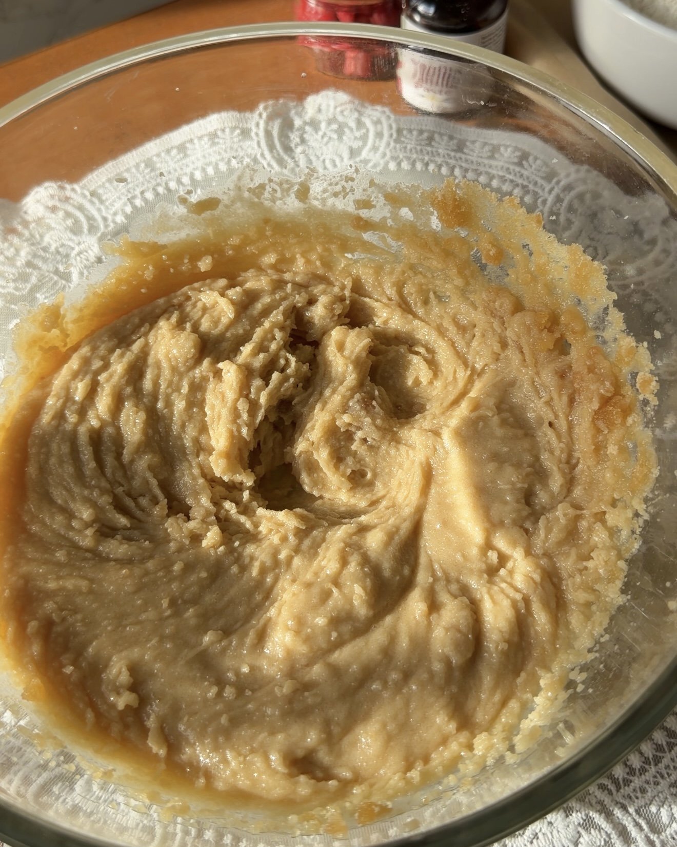 melted butter, granulated sugar, and brown sugar mixed in a bowl.