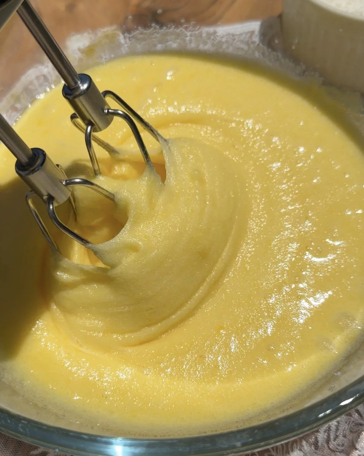 egg and sugar beaten with electric mixer in bowl