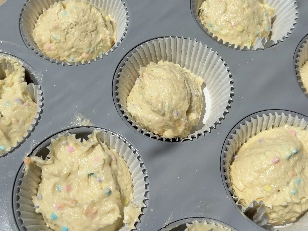 cupcake batter inside cupcake liners