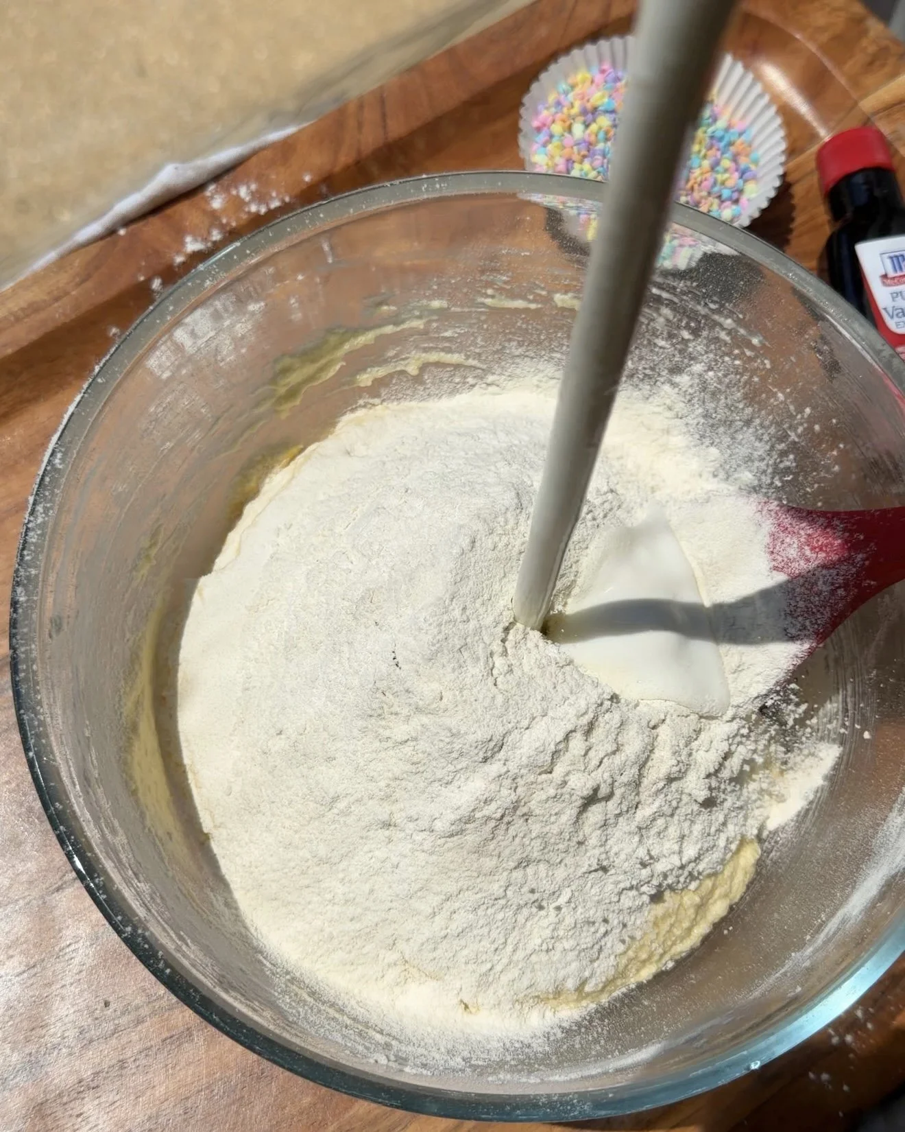 buttermilk streamed into funfetti cupcake batter (Copy)