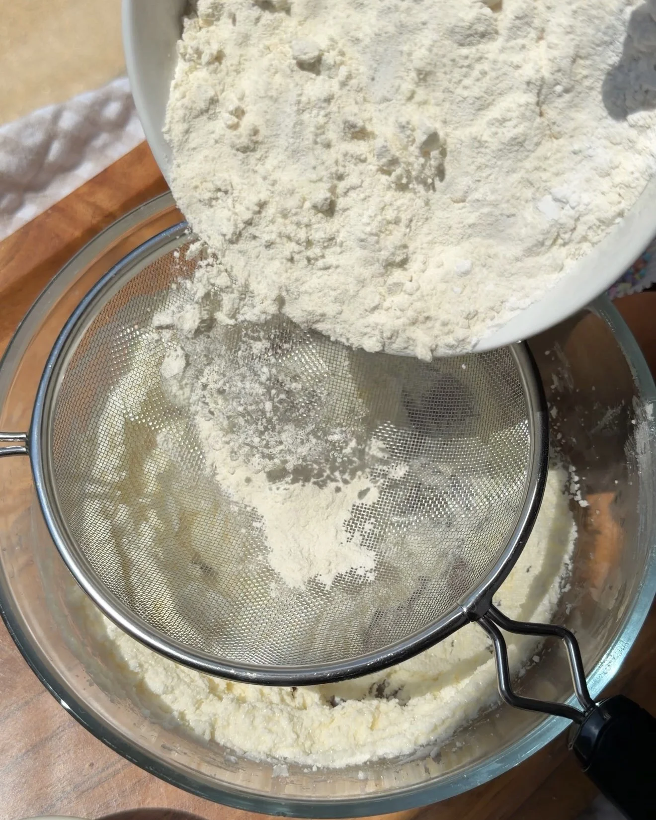 dry ingredients being sifted into wet ingredients (Copy)