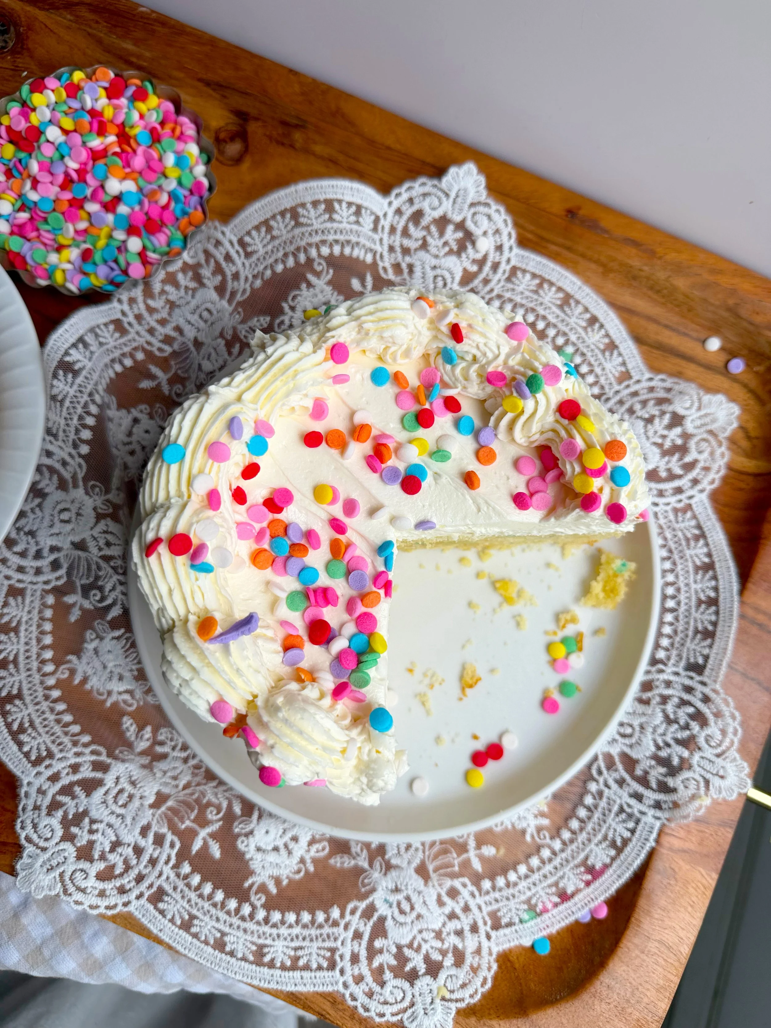 Frosted funfetti cake with sprinkles. 
