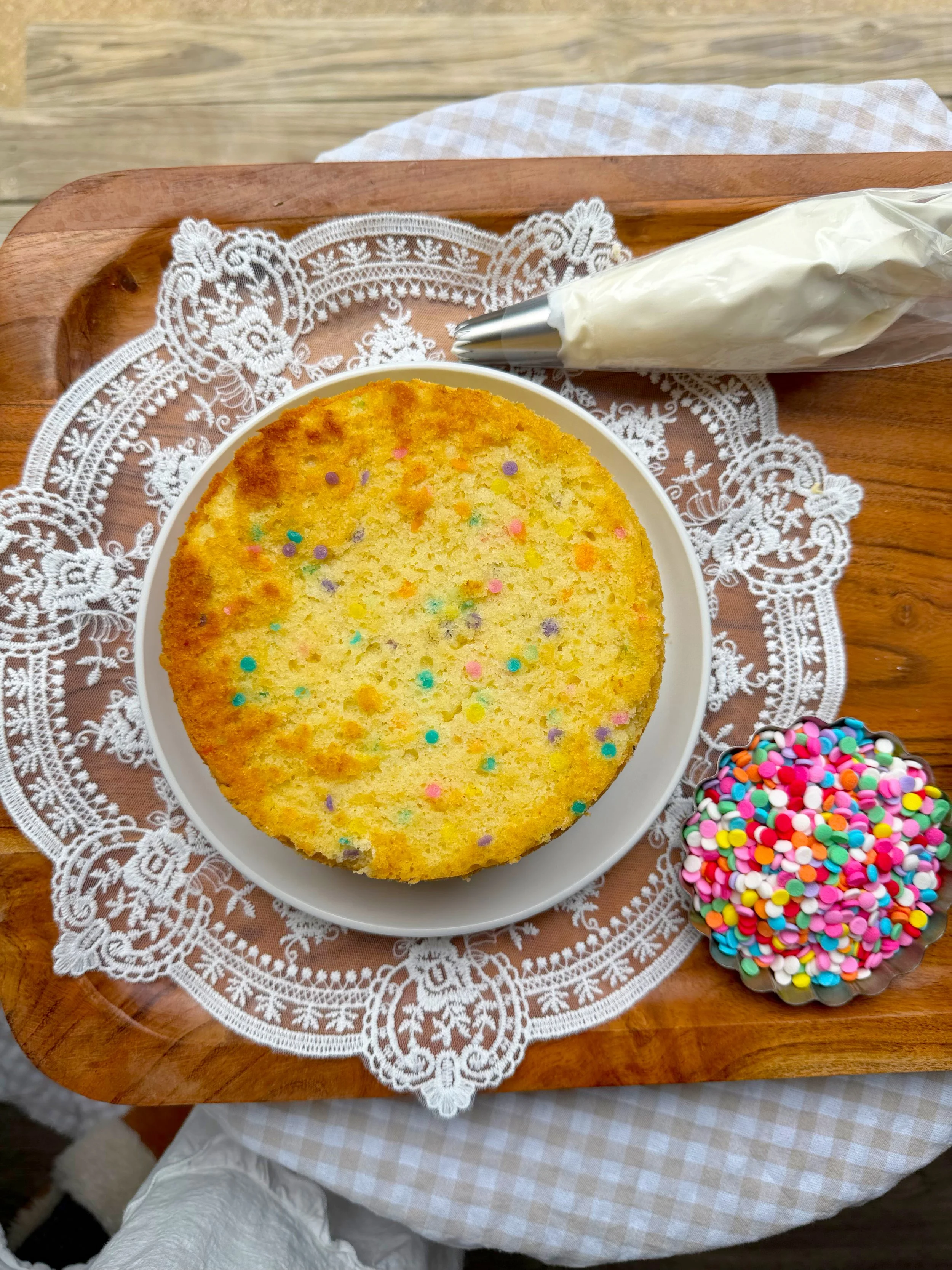 Unfrosted funfetti cake on the counter