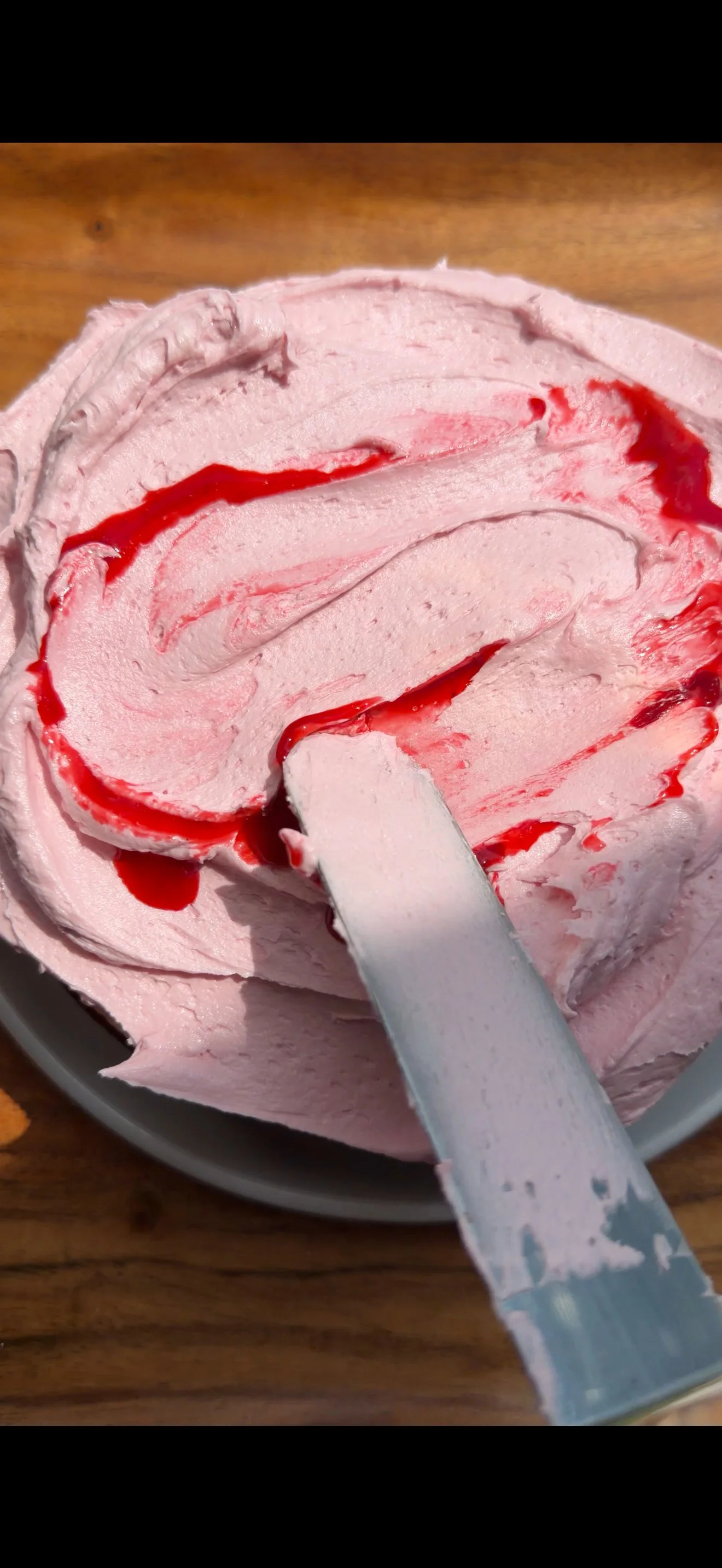 Raspberry syrup swirled into raspberry buttercream. 