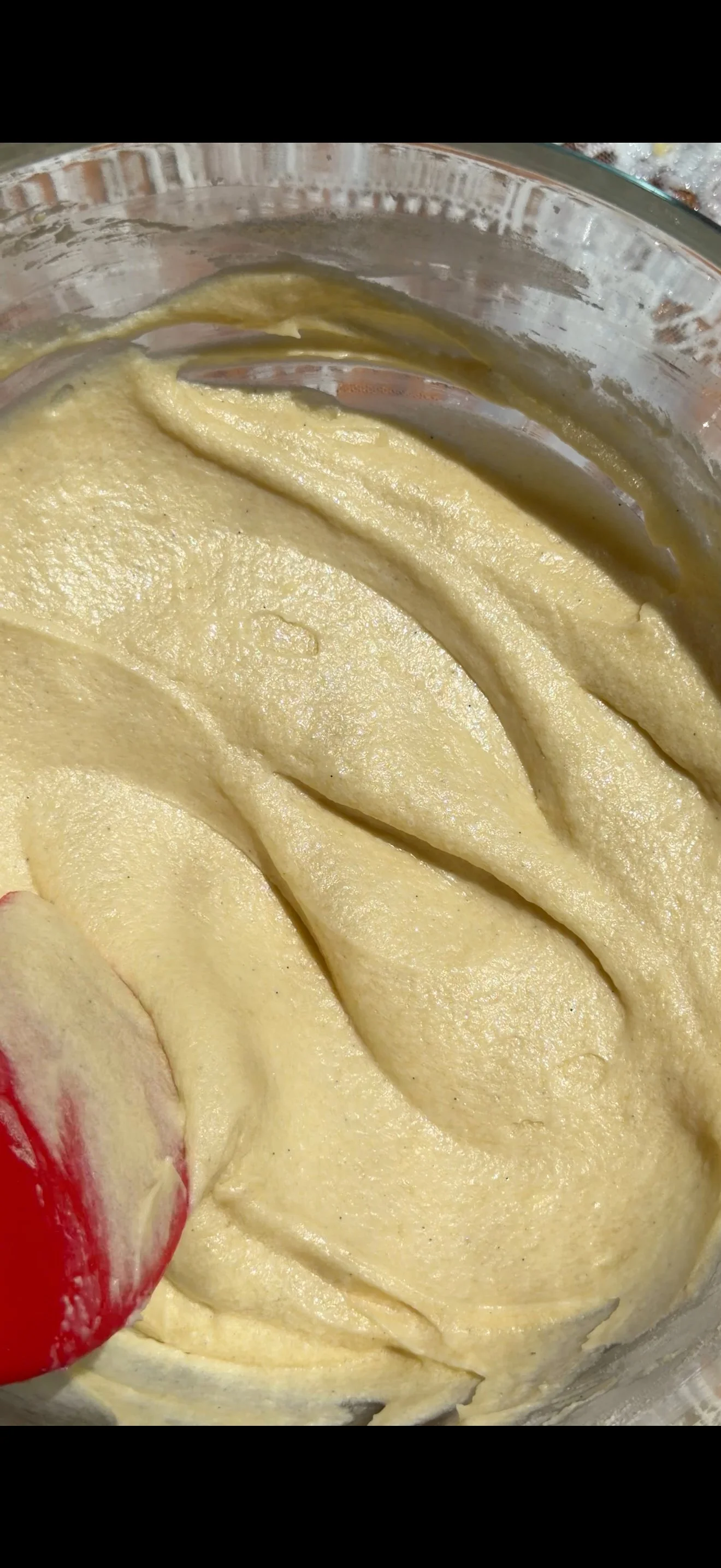 Close up of cake batter in mixing bowl. 