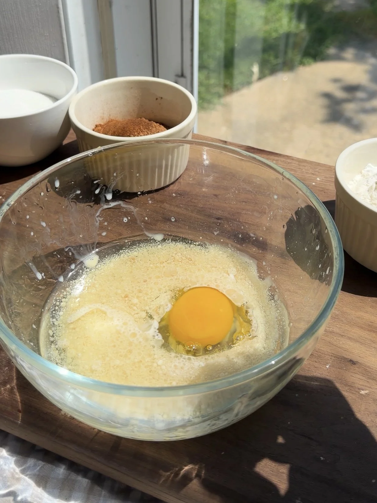 Chocolate cake batter being mixed in a bowl before baking