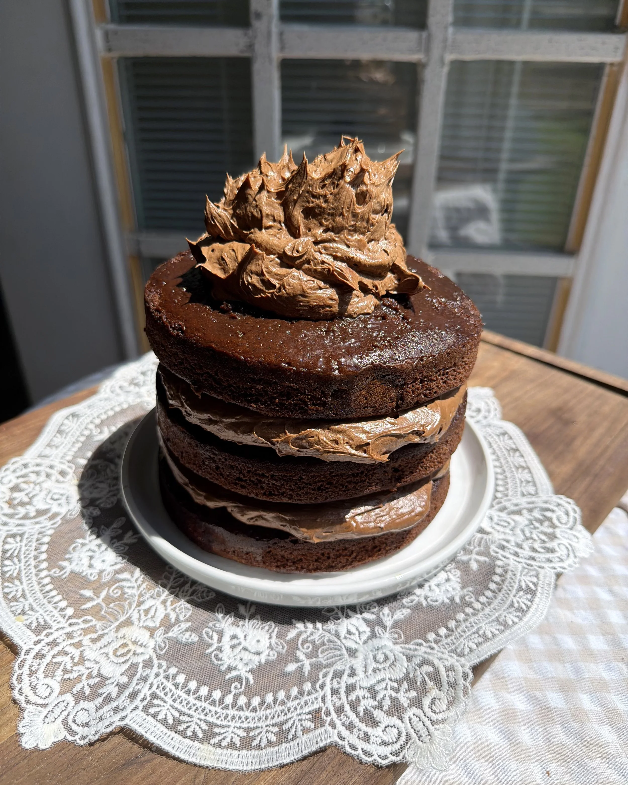 Homemade three layer chocolate cake made with five main ingredients