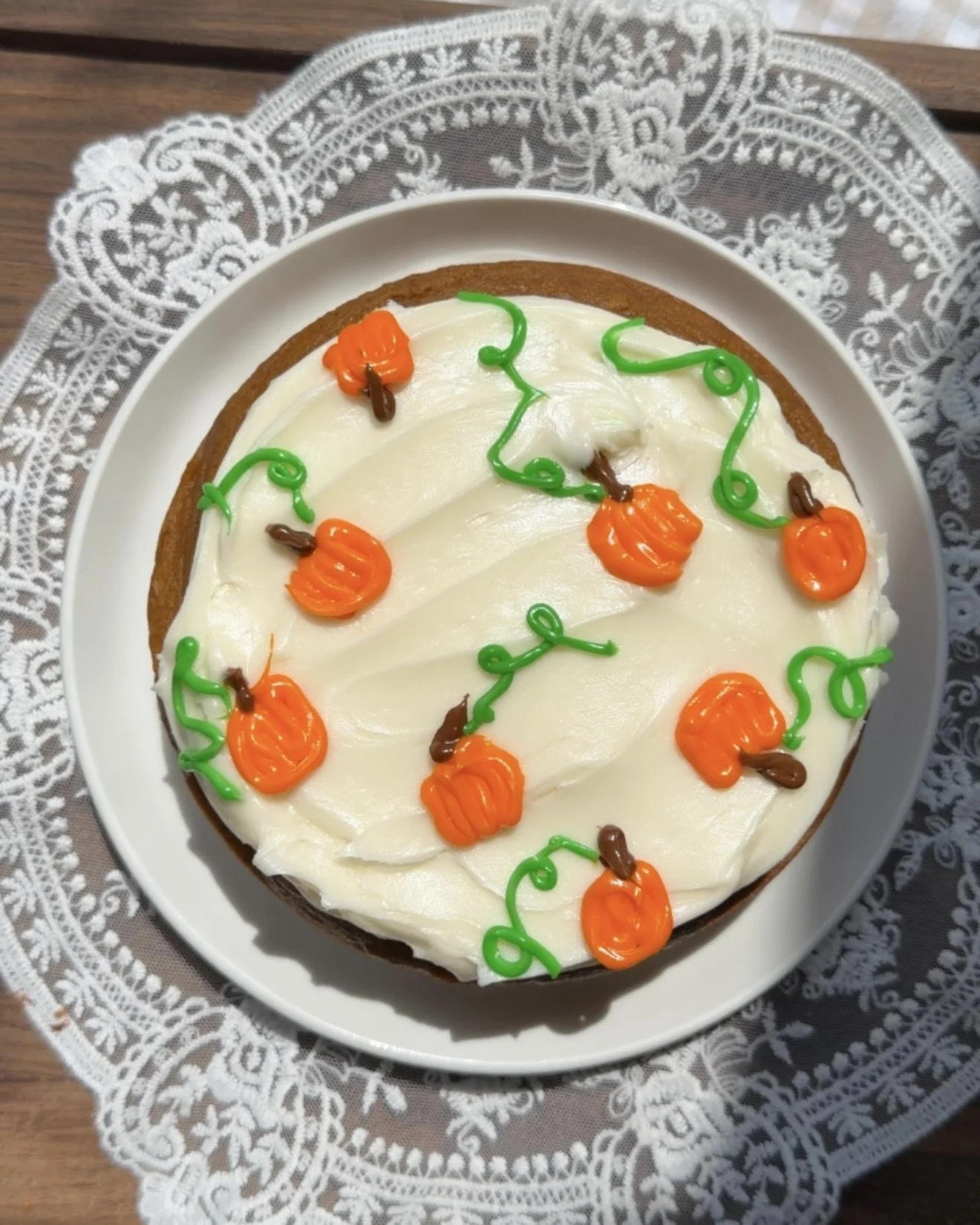 Small 6 inch pumpkin cake topped with cream cheese frosting