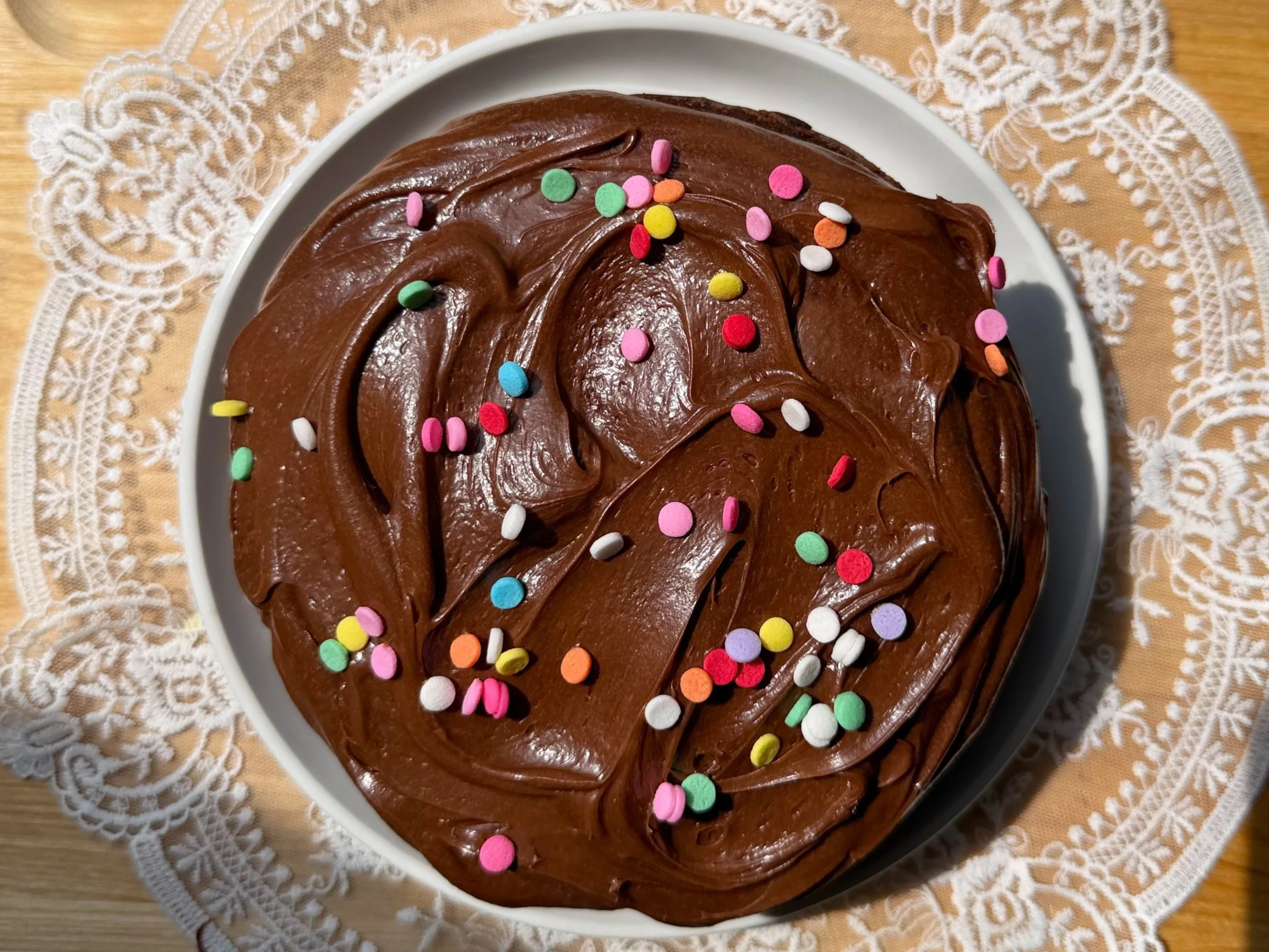 Moist 6 inch chocolate cake topped with swirled chocolate frosting