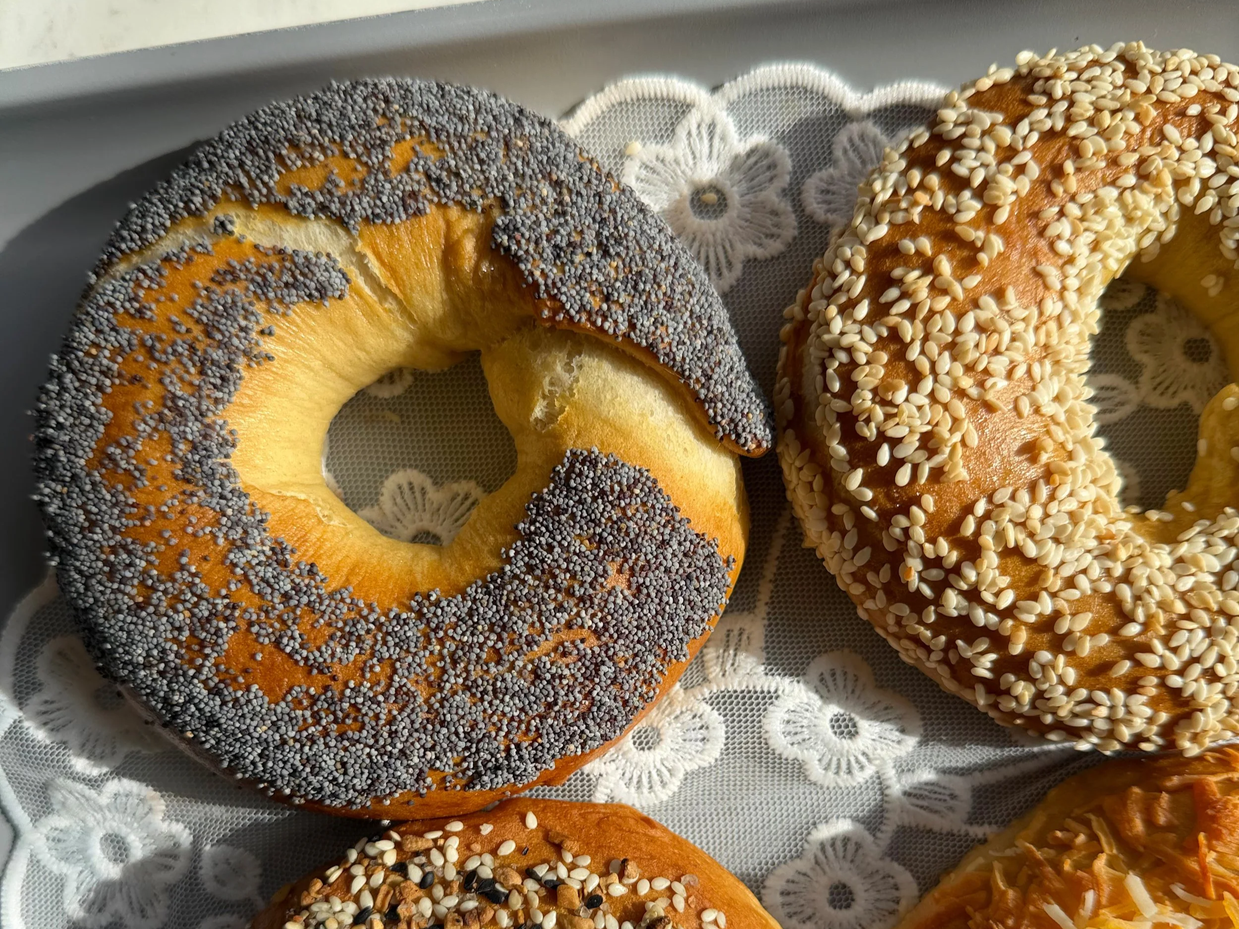 4 bagels on a baking tray