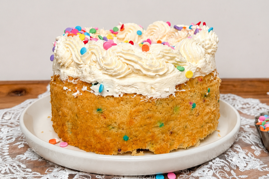 Finished frosted funfetti cake on counter