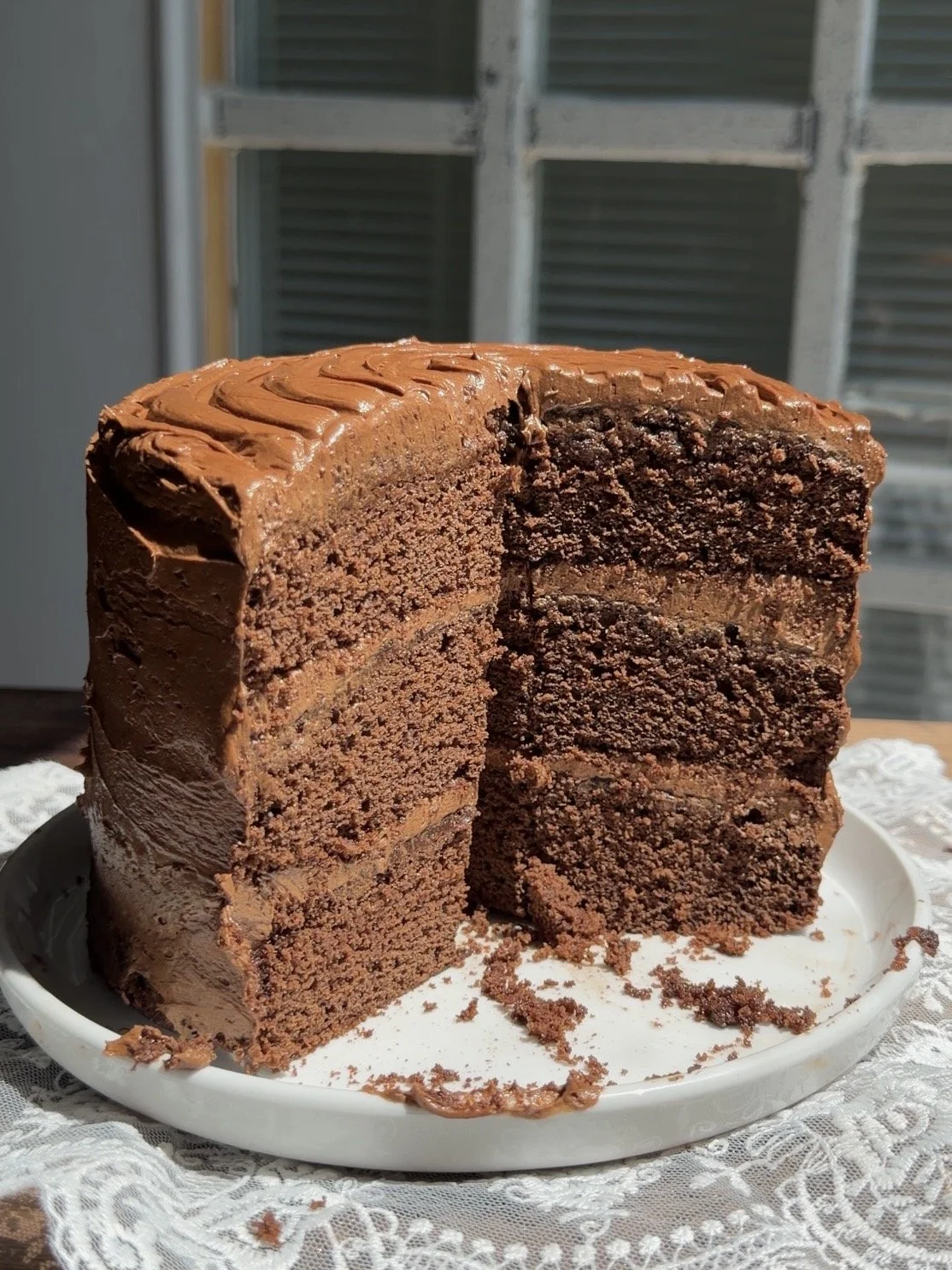 Small 6 inch chocolate layer cake with rich cocoa flavored cake and frosting