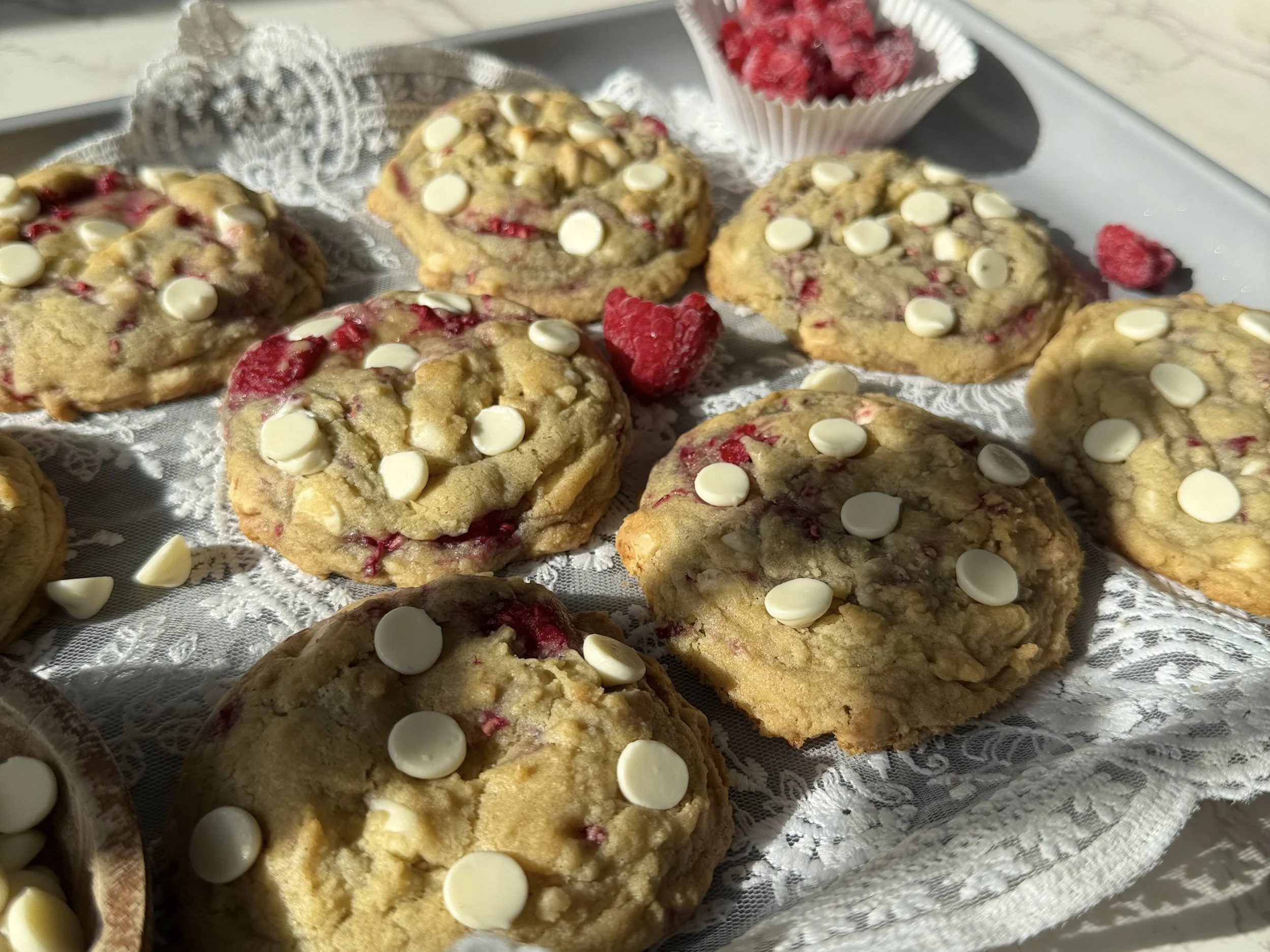 raspberry white chocolate chip cookies on baking sheet.