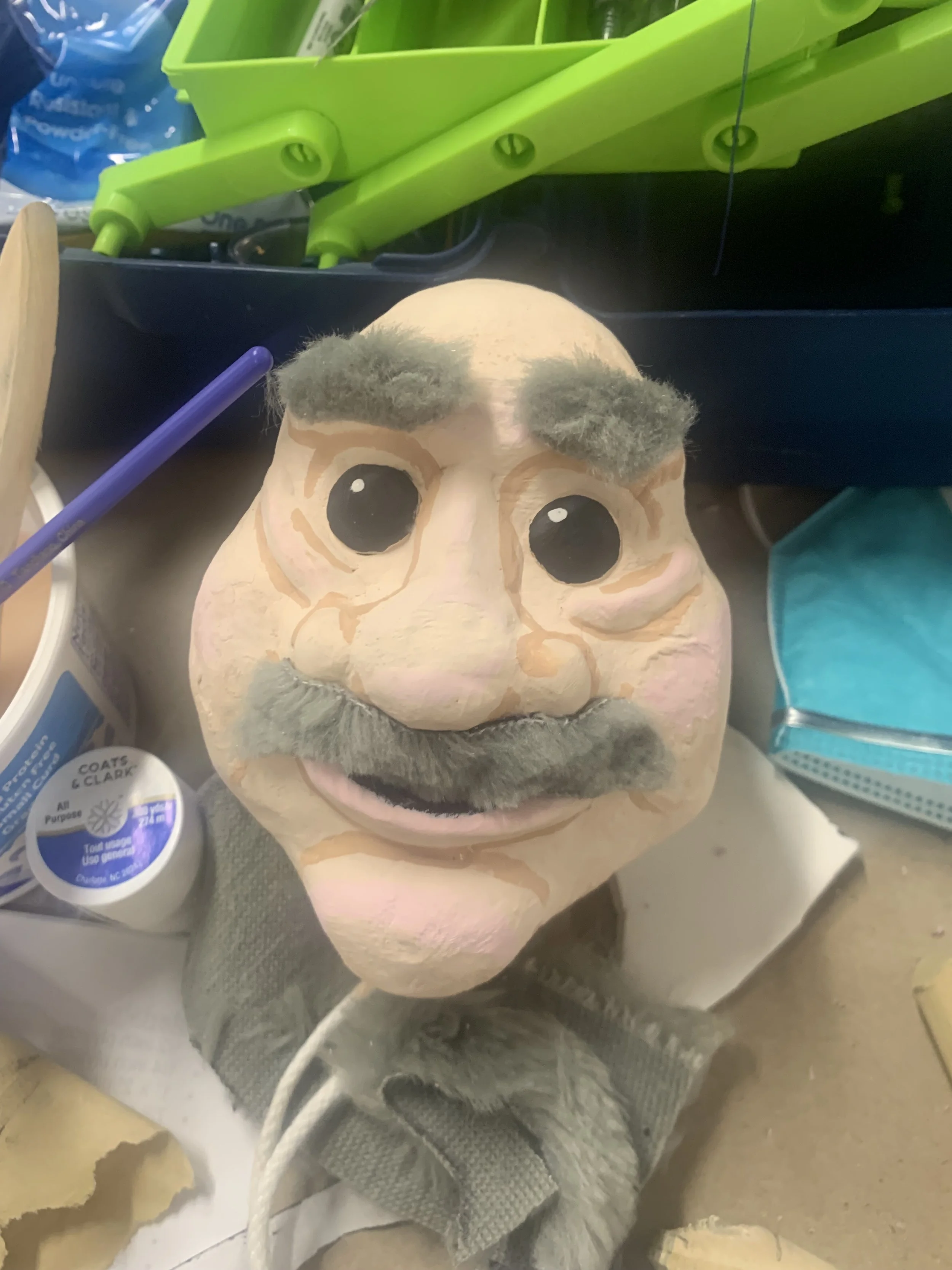 fully painted head with facial features attatched