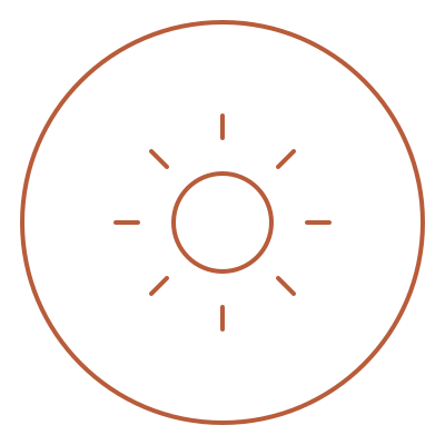 A digital illustration of a camera lens with concentric circles and radiating lines, depicted in a minimalistic line art style.