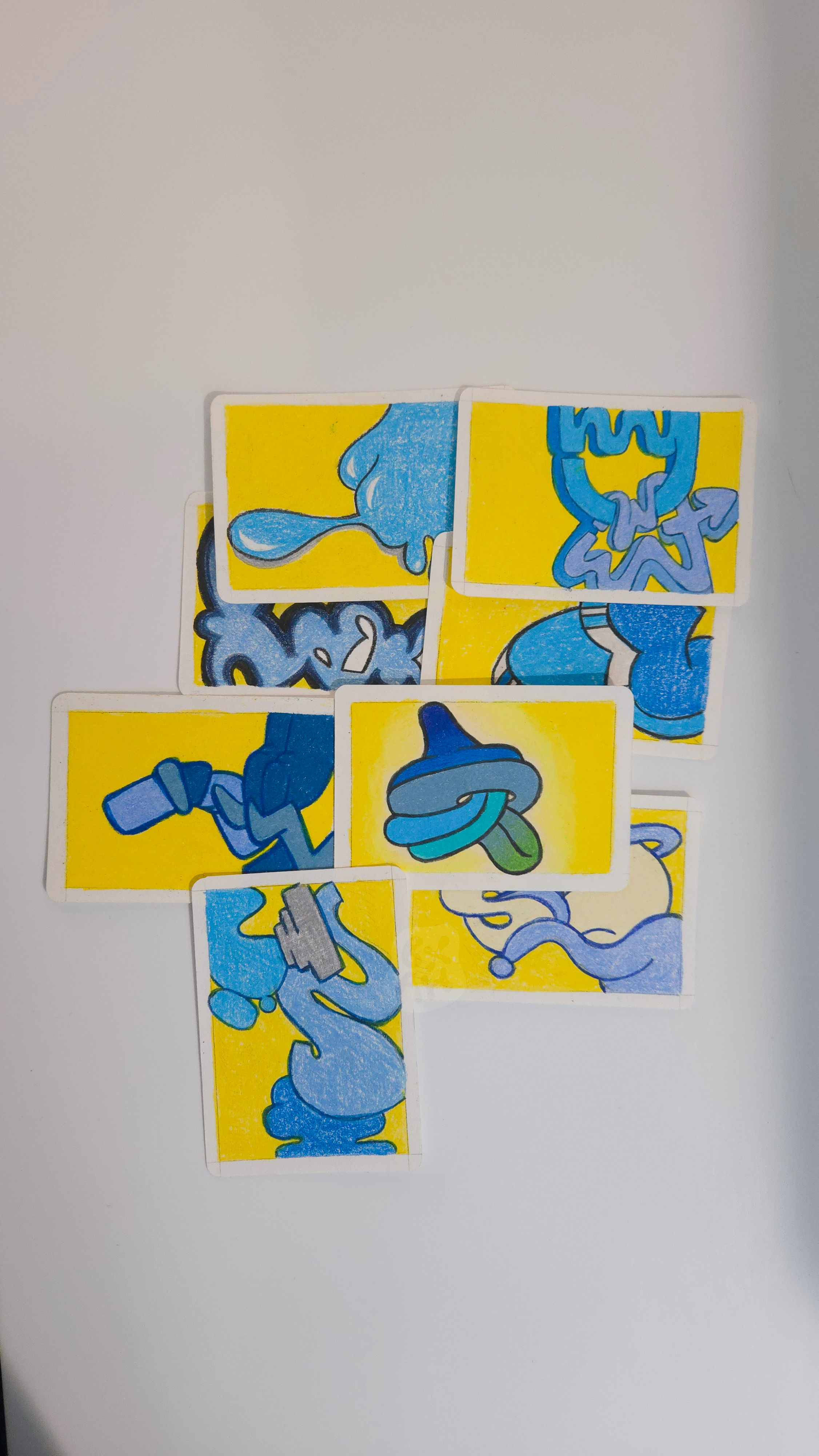 A collection of colorful cartoon cards, each with illustrations of various objects and characters on a yellow background.