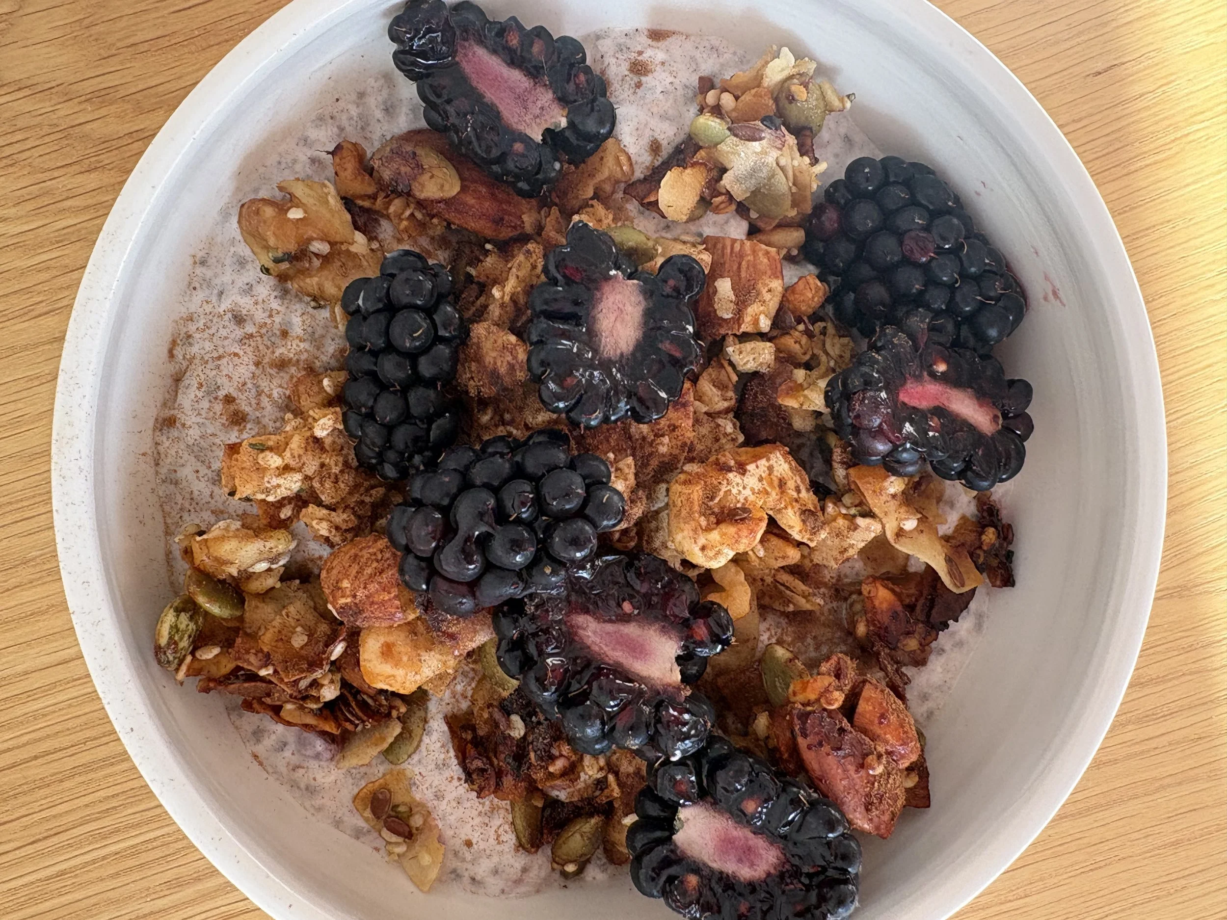 chia seed pudding, granola and fresh blackberries