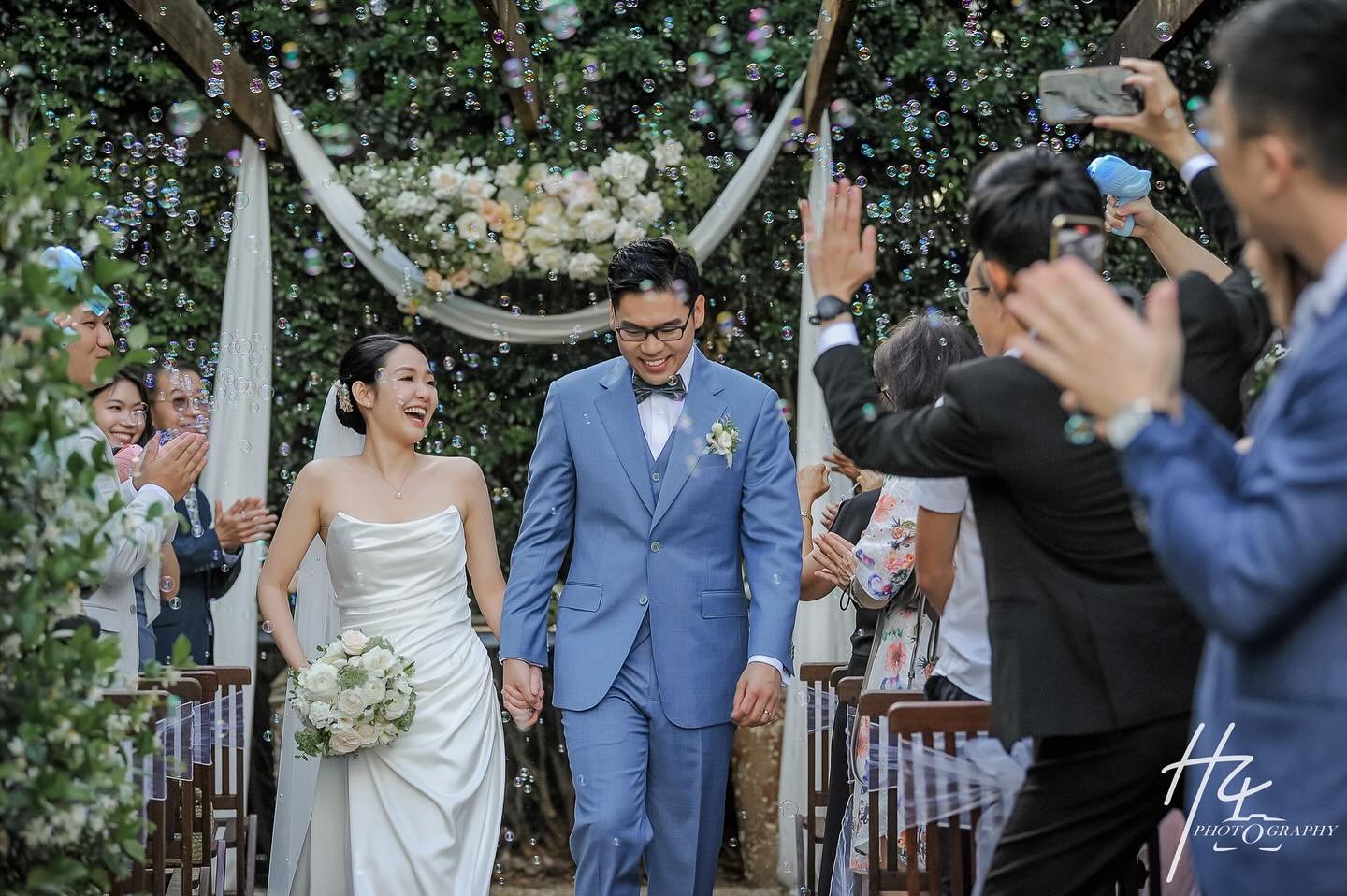 ✨ Love, laughter, and bubbles fill the air as this beautiful couple takes their first steps as husband and wife. ✨. 
#H4Photography #BrisbaneWedding #LoveAndJoy #WeddingPhotography #WeddingCeremony #HappilyEverAfter #BrisbaneCelebrant #loveintheair
