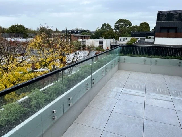 View from a rooftop balcony with GRC balcony planters connected to glass balustrades..