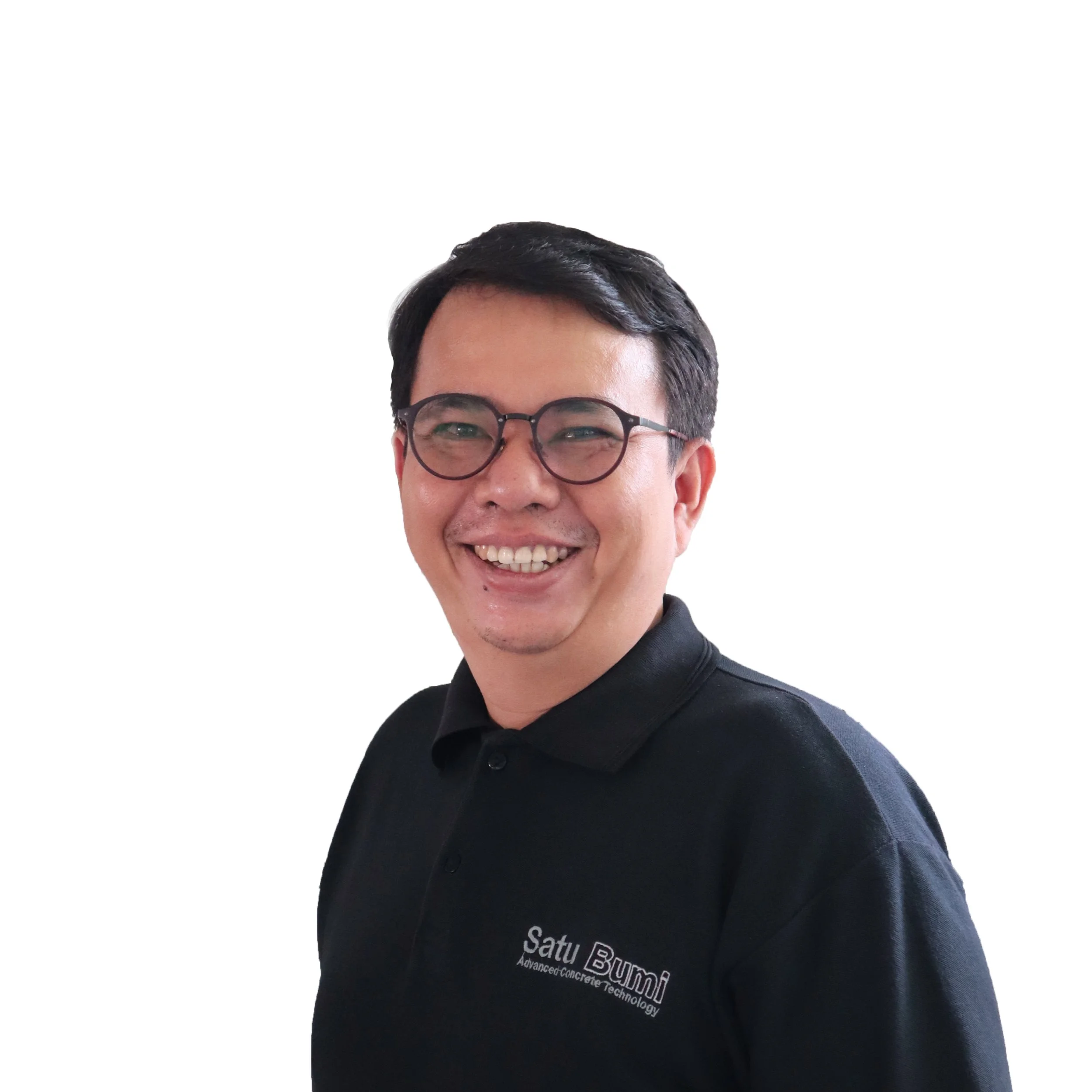 Smiling person wearing glasses and a black polo shirt with "Satu Bumi Advanced Concrete Technology" logo.