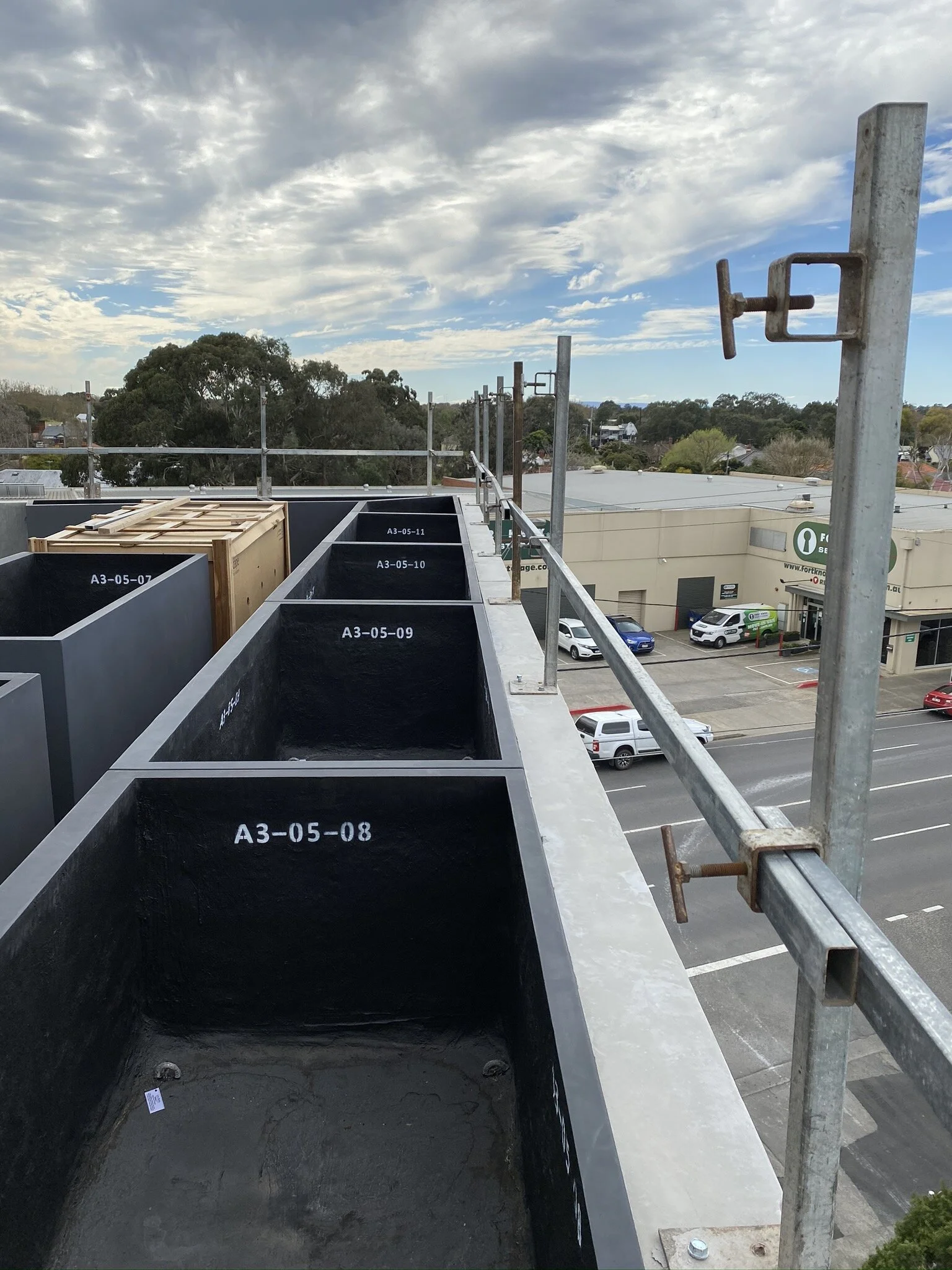 GRC planters installed sequentially in accordance with their project plan numbering system