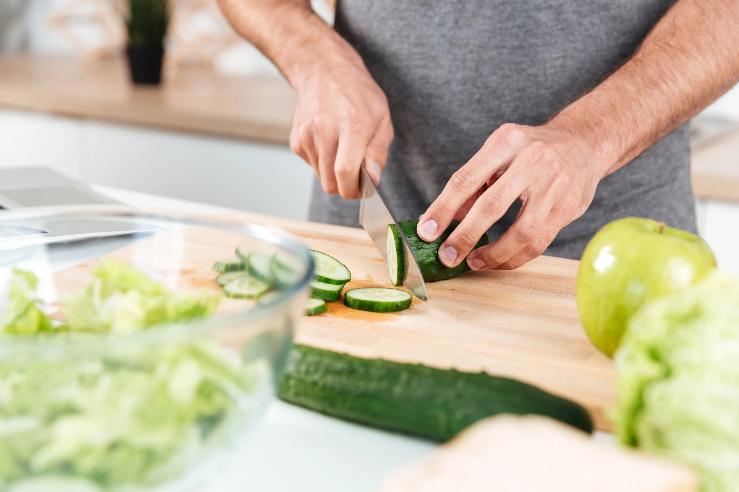 ELF Concierge, Man cooking cutting vegetables