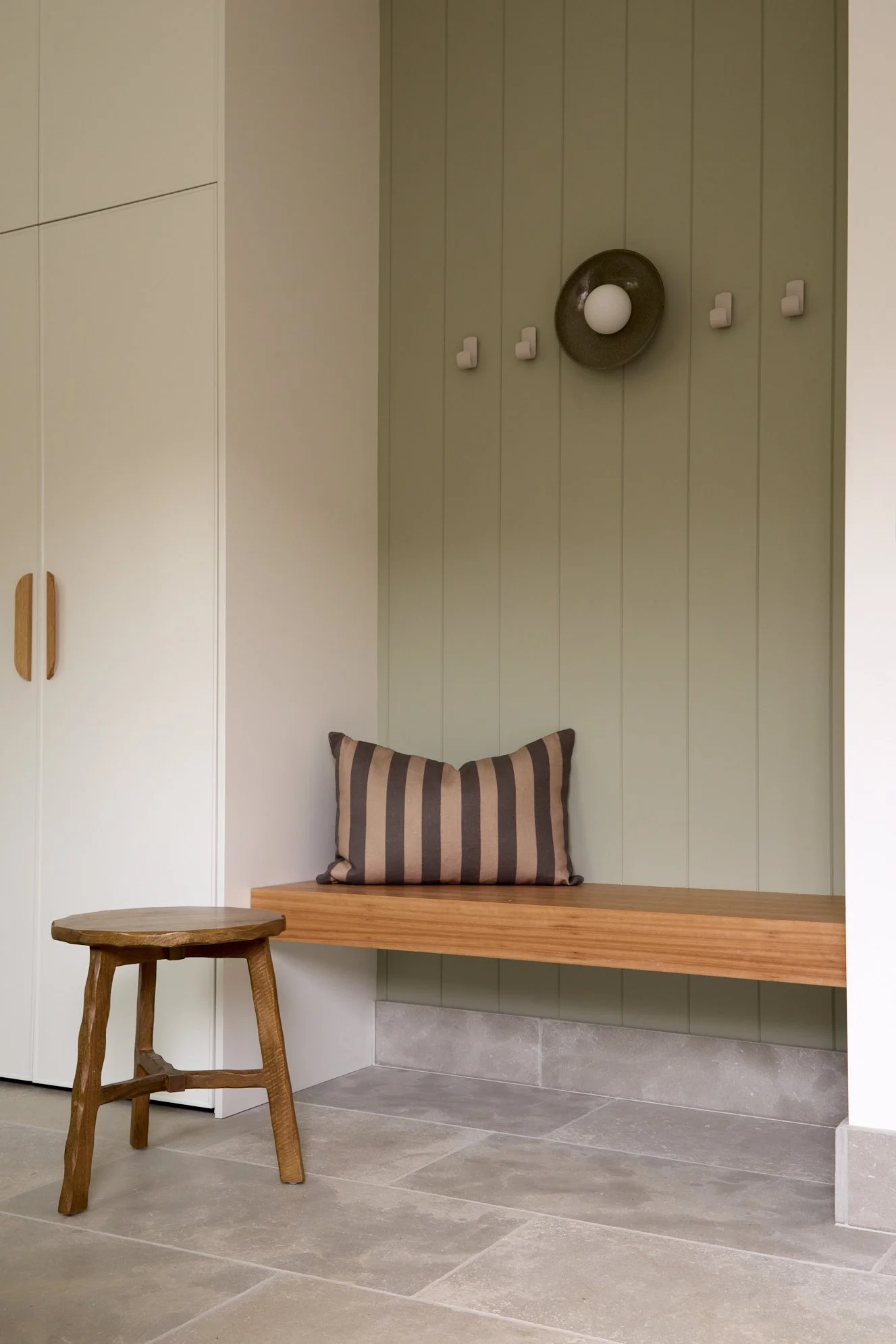 Alpine laundry design in Jindabyne with handmade tiles and custom white cabinetry