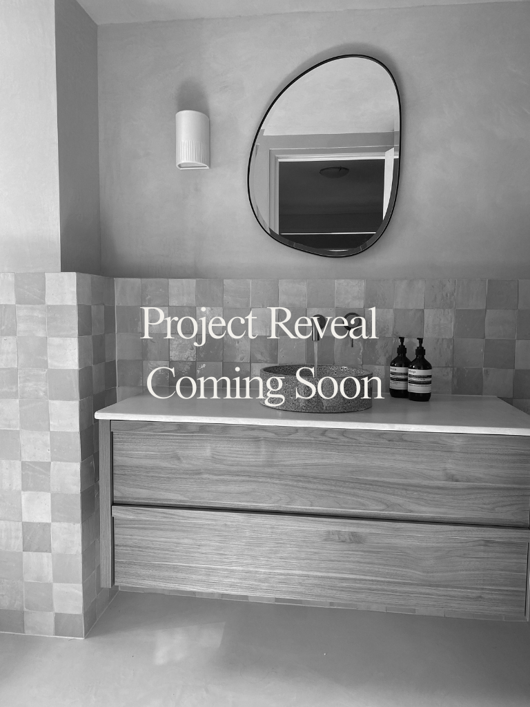 Microcement bathroom in Jindabyne featuring zellige tiles, timber vanity, antique brass tapware and Robert Gordon basin