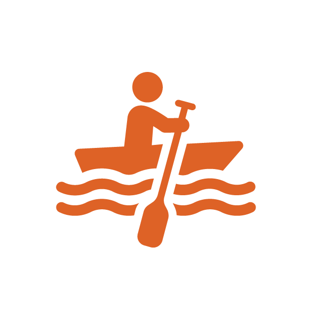 Silhouette of a person rowing on water with a paddle.