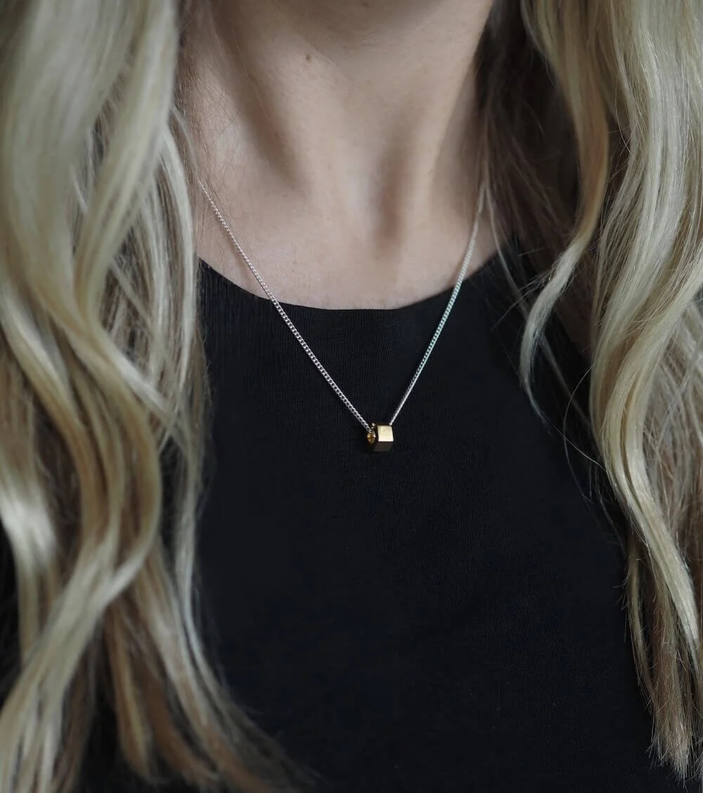 Mixed metal silver and gold minimalist pendant modelled