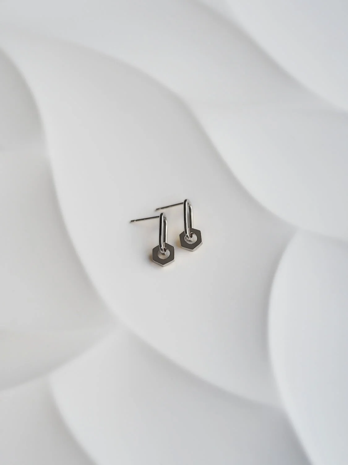 Sterling silver oval drop earrings with hex drop detail