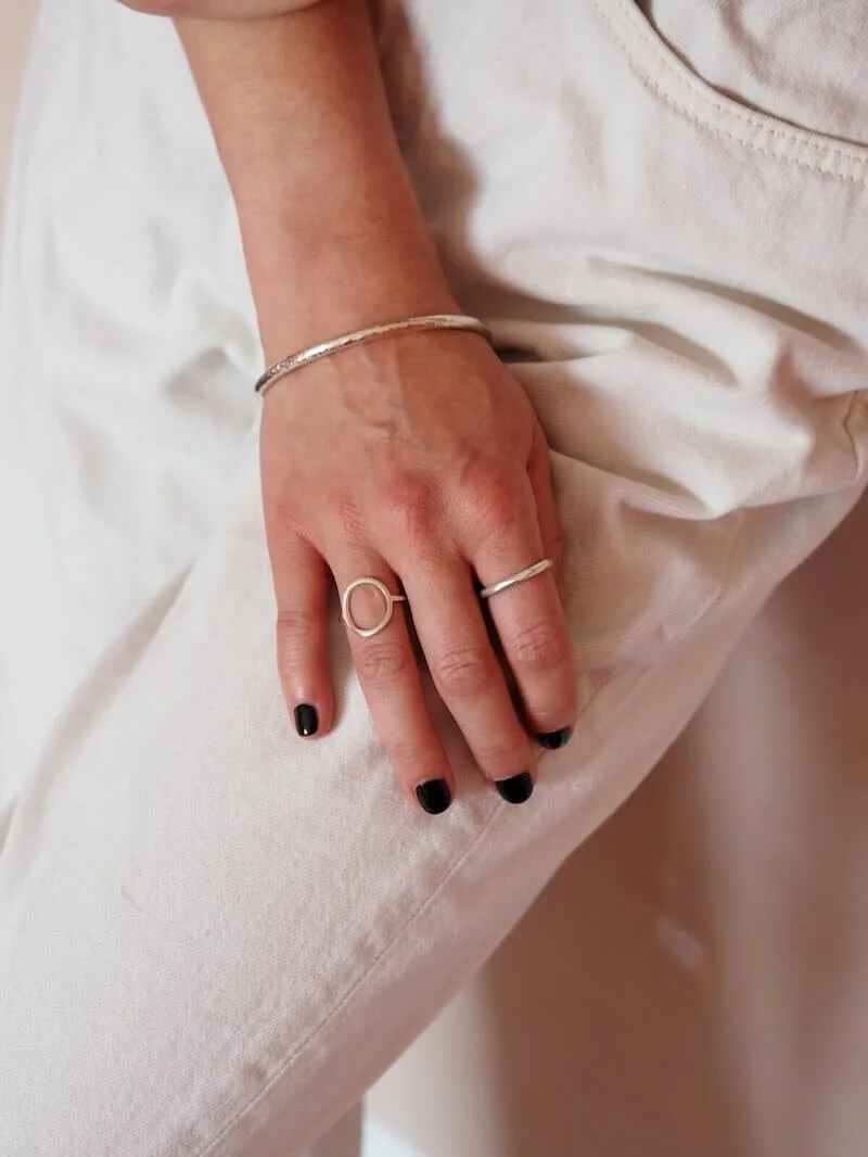 Sterling Silver round hammered bangles modelled