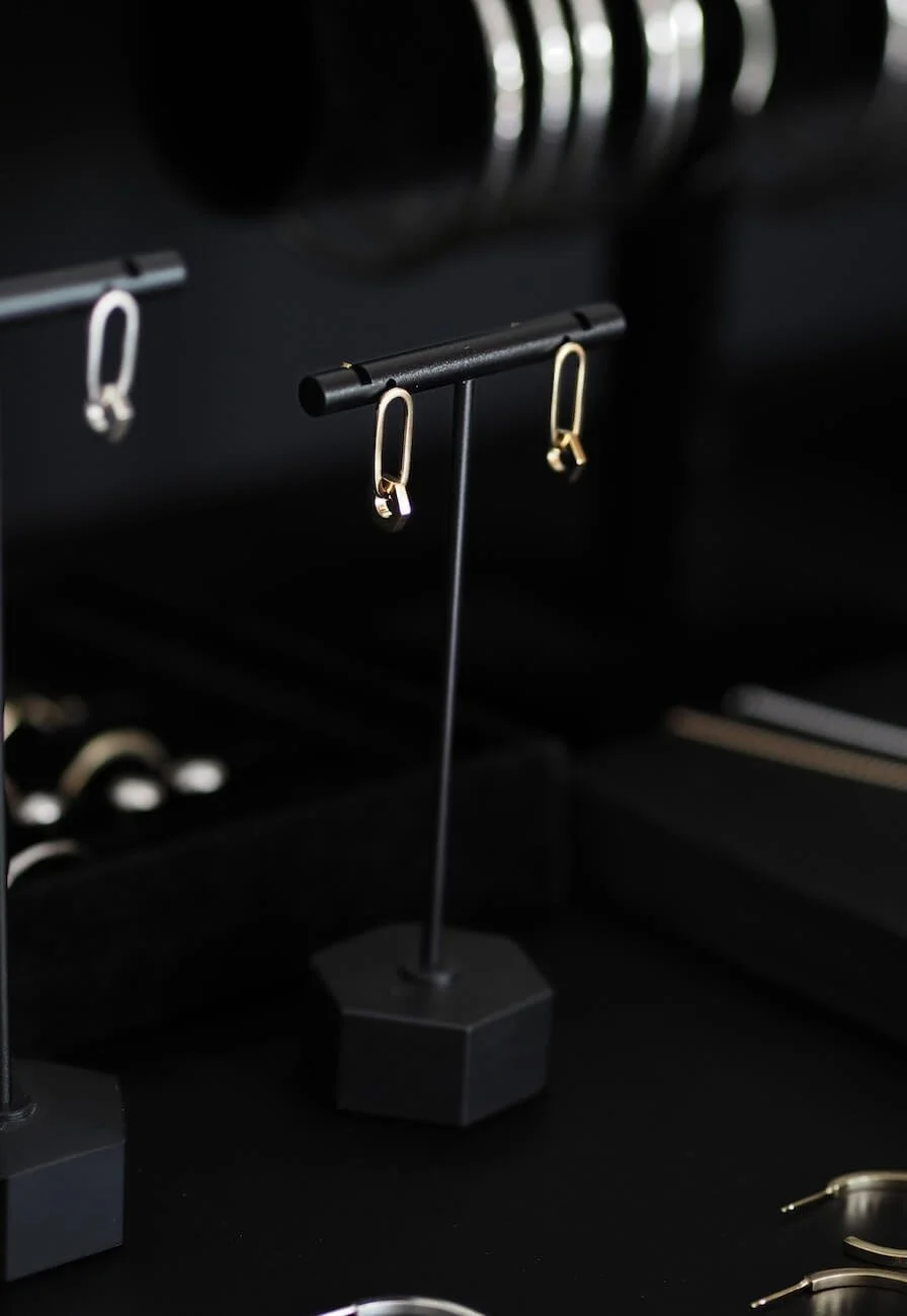 Gold drop earrings with a hexagon drop detail