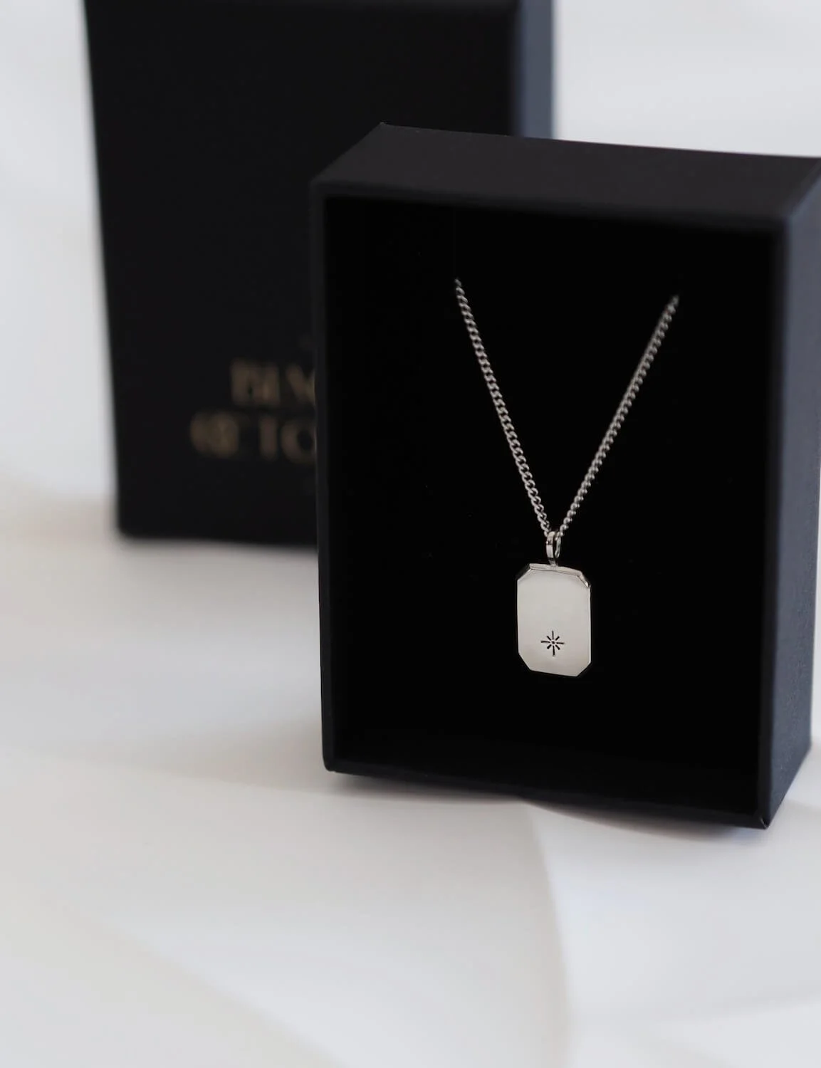 Silver modern star rectangle pendant in luxury packaging
