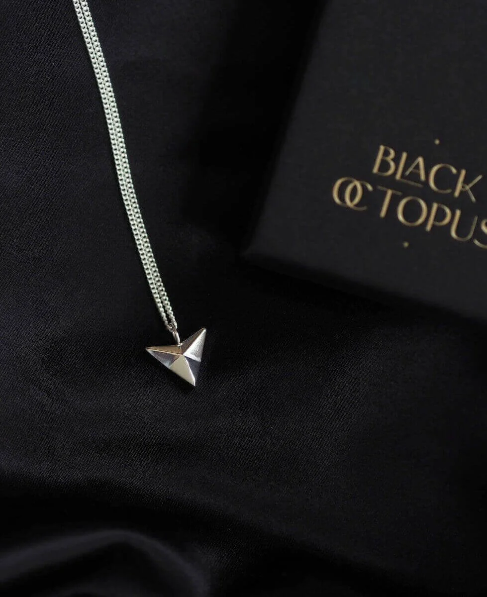 Silver arrowhead pendant necklace on curb chain