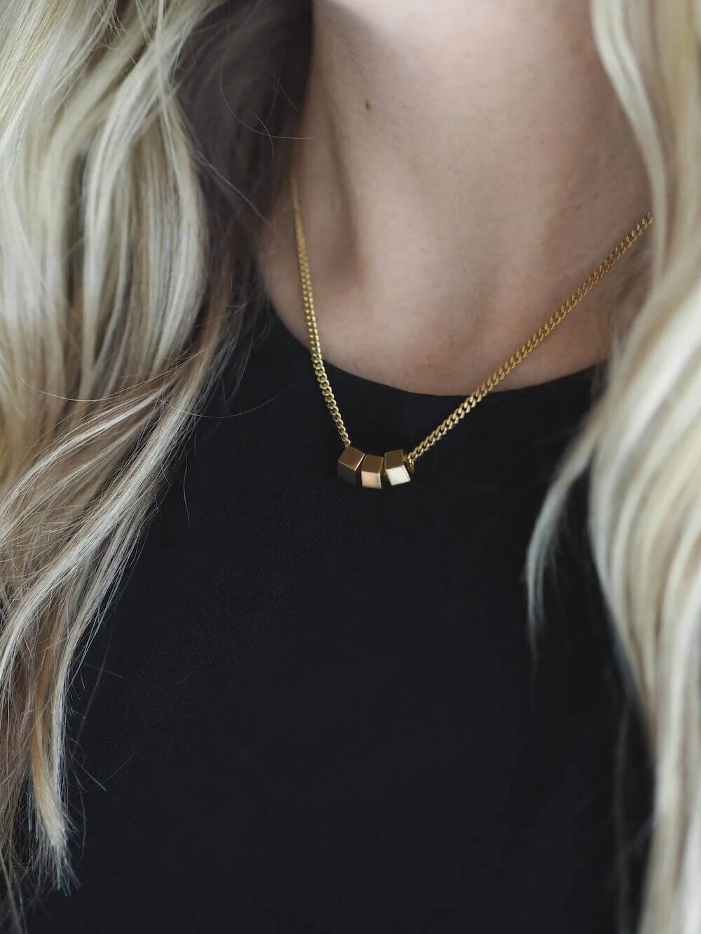 Gold hex trio necklace on a statement curb chain