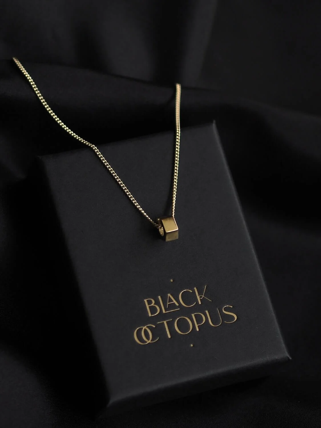Gold pendant necklace with a single hexagon 'hex nut' pendant