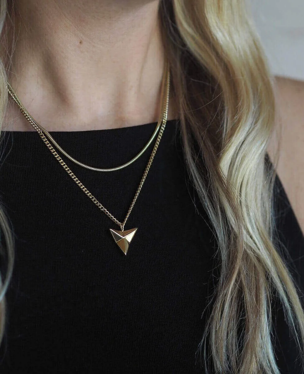 Gold statement arrowhead pendant necklace modelled