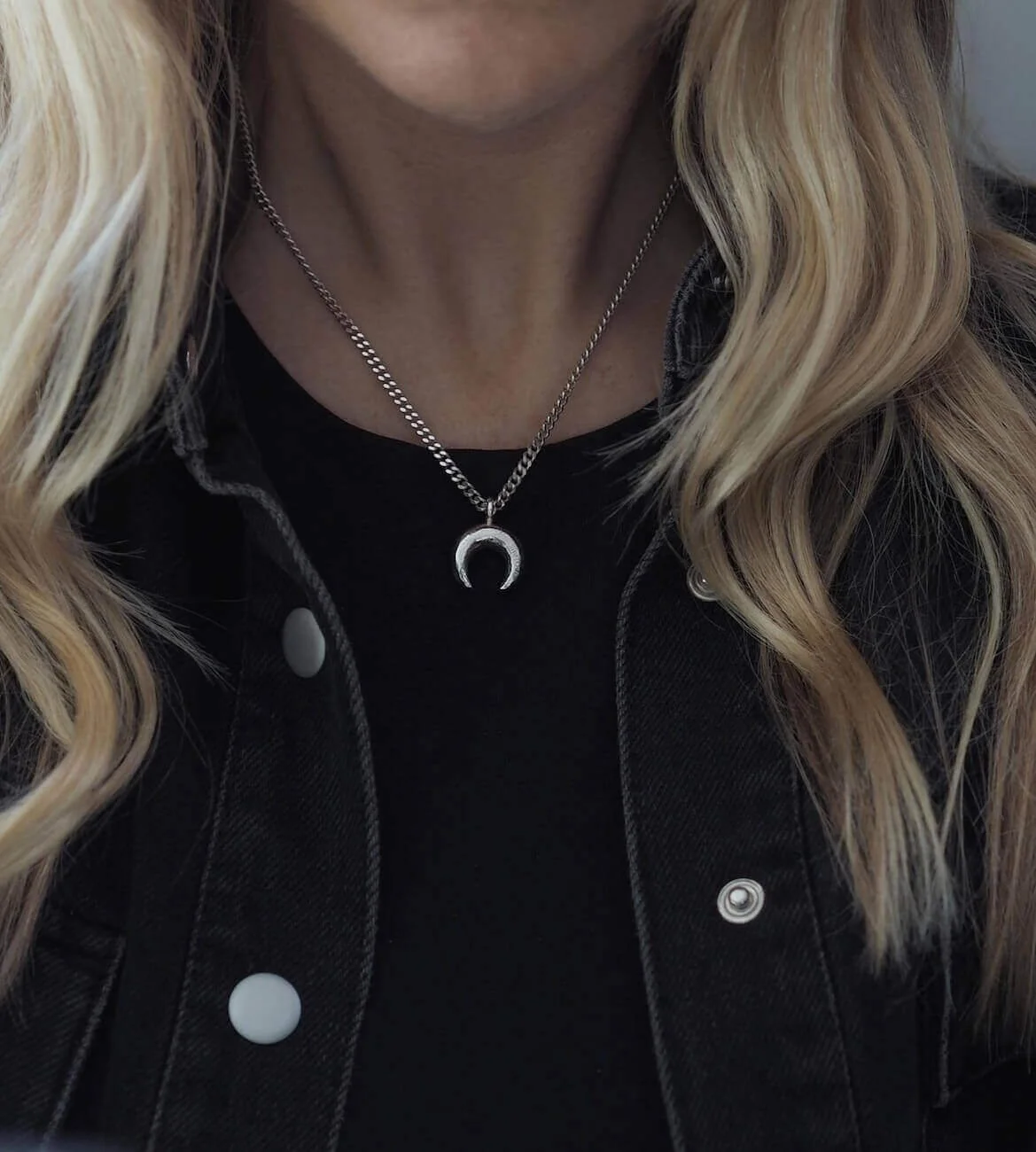 Alternative silver crescent moon pendant necklace on model