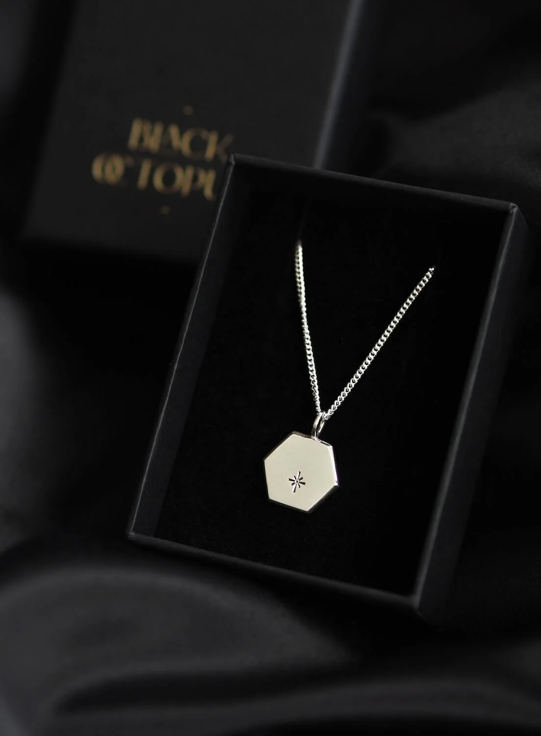 Silver hexagon star pendant