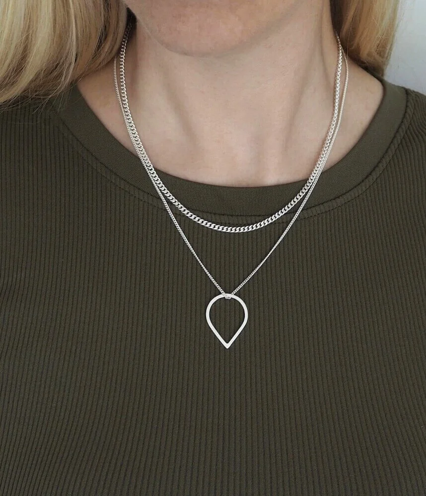 Sterling Silver teardrop pendant necklace modelled with layering chain