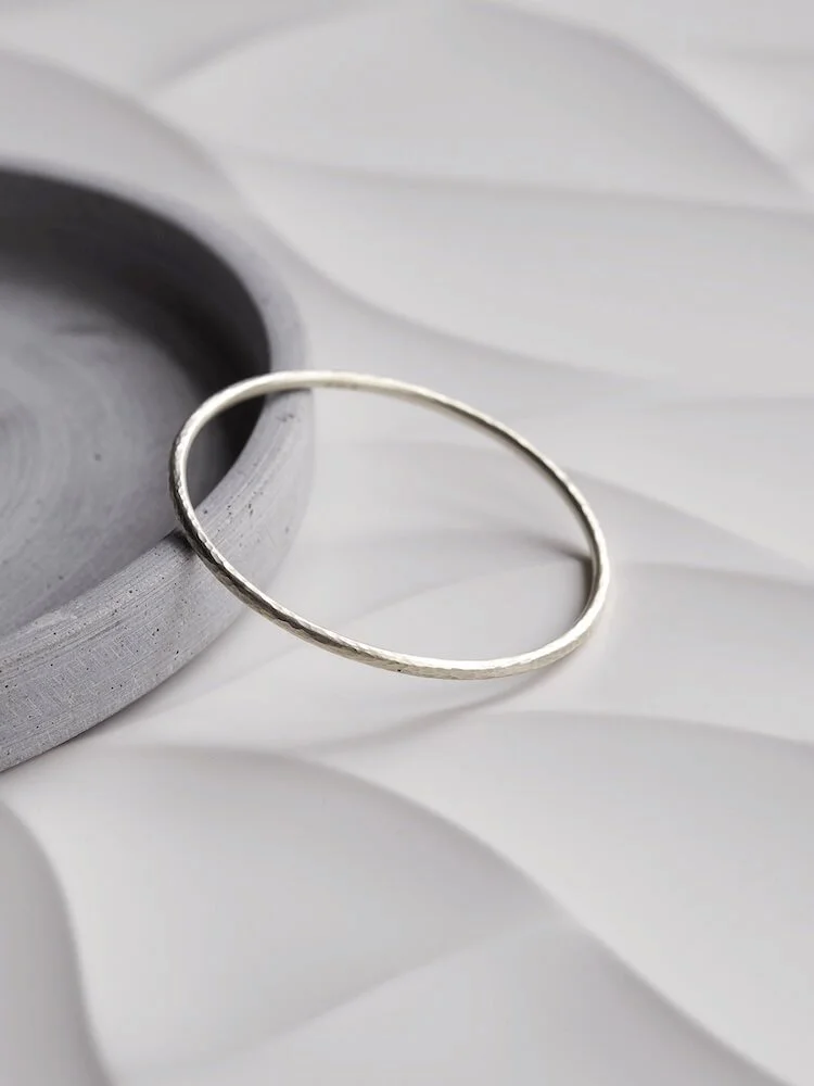 Round hammered Sterling Silver bangle with hallmark