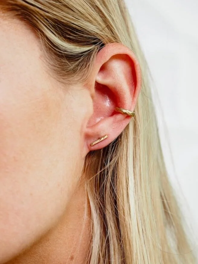 Gold Vermeil hammered bar stud earrings modelled with gold ear cuff
