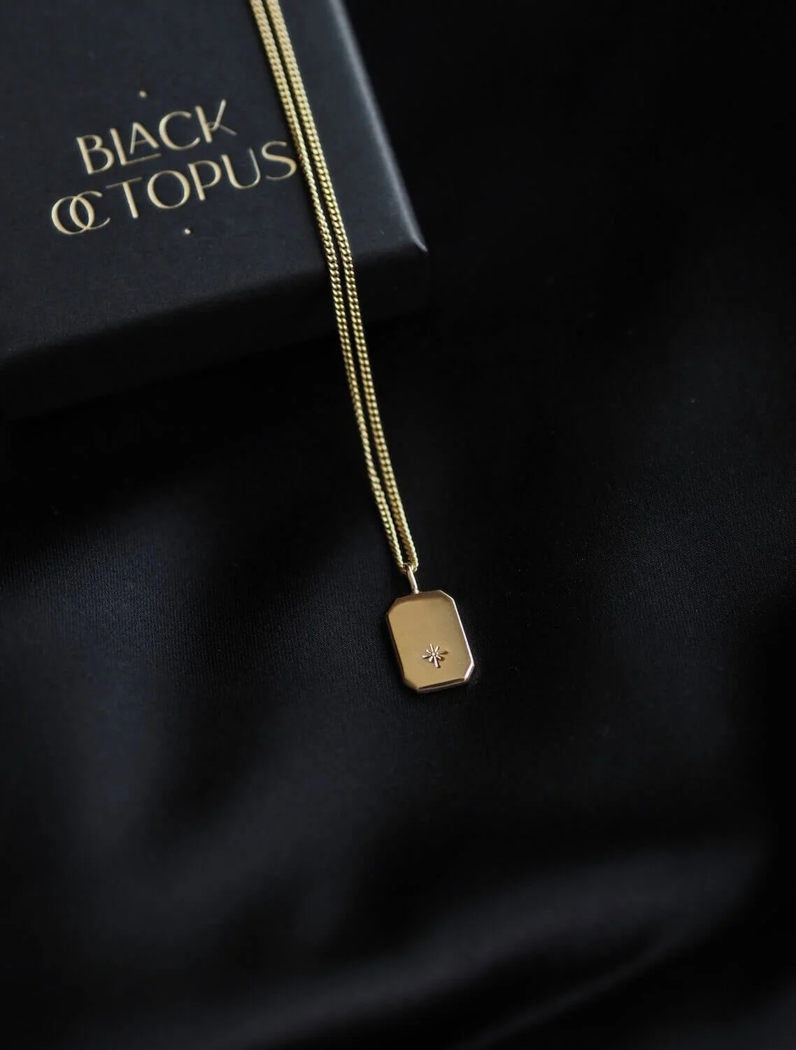 Gold modern rectangle pendant with a celestial star design