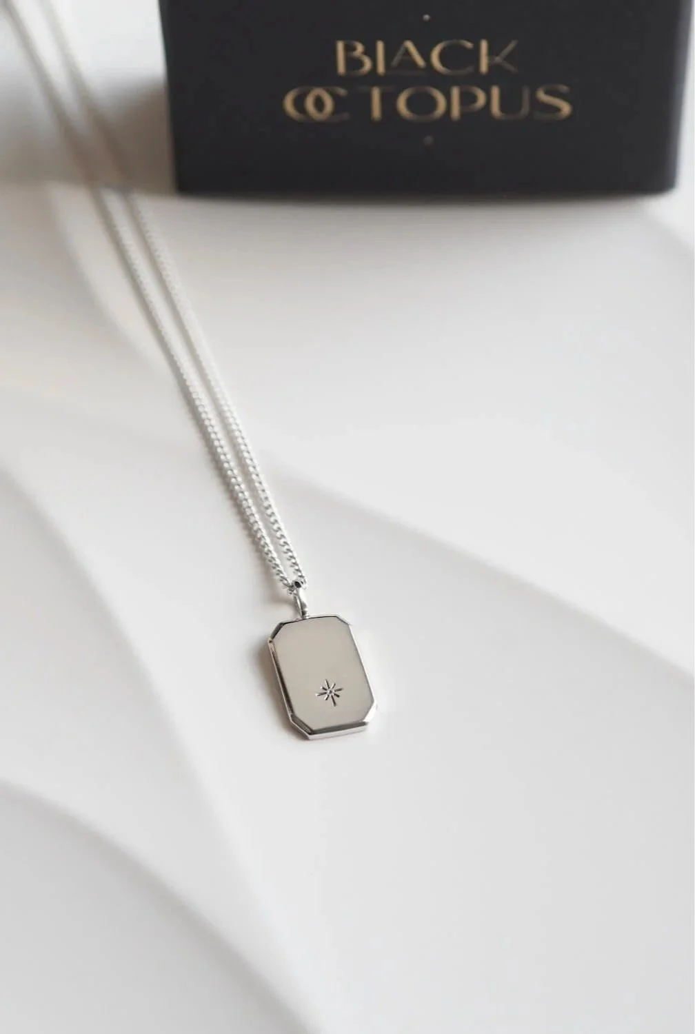 Modern silver pendant with star design